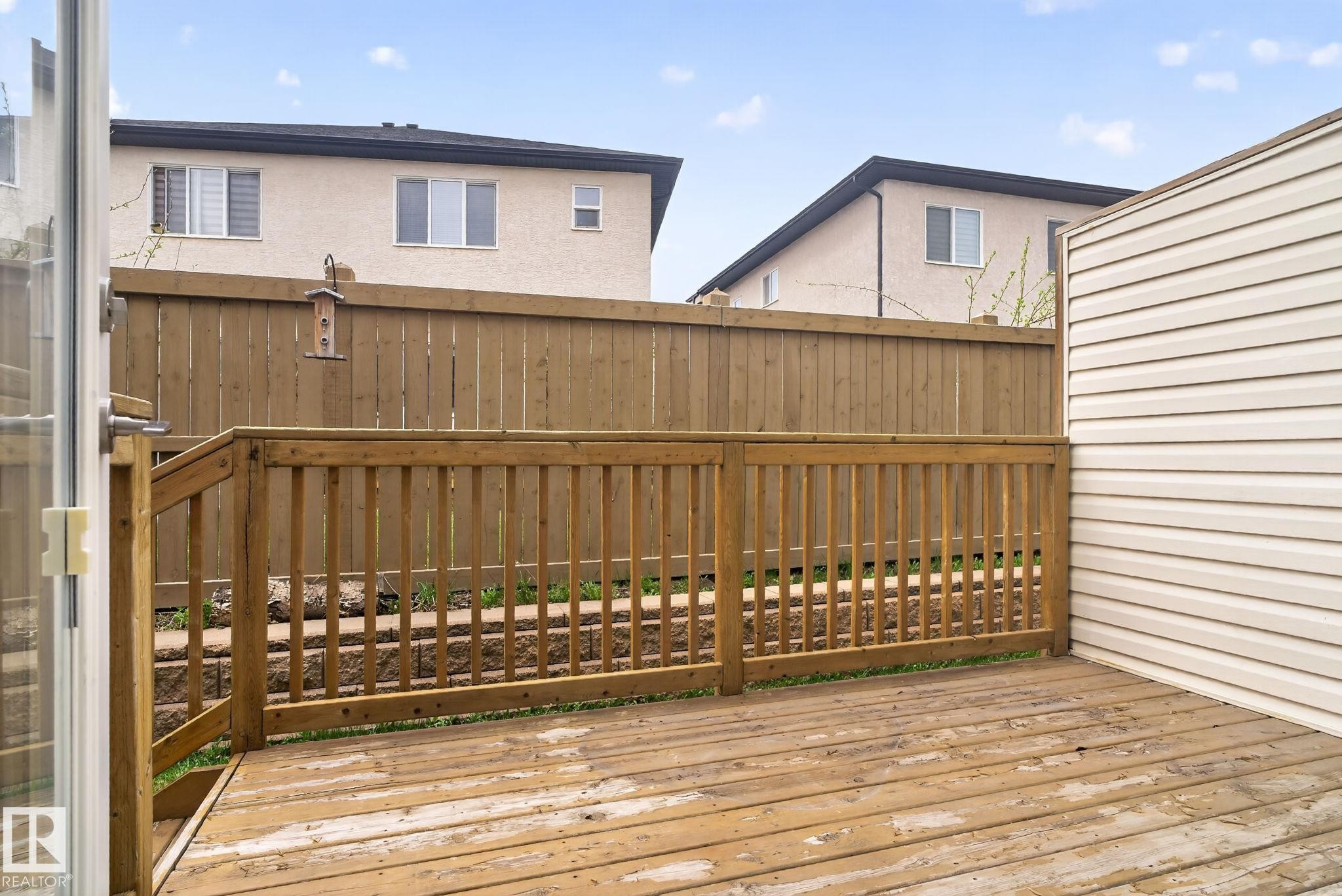 Wood deck with a slatted railing, providing an outdoor extension - 11 450 Mcconachie Way, Edmonton, AB - Outdoor With Exterior