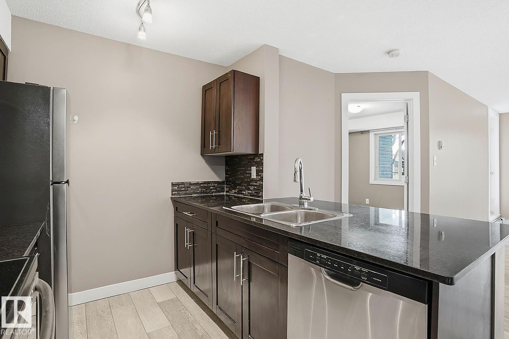 109 11803 22 Avenue, Edmonton, AB - Indoor Photo Showing Kitchen With Double Sink