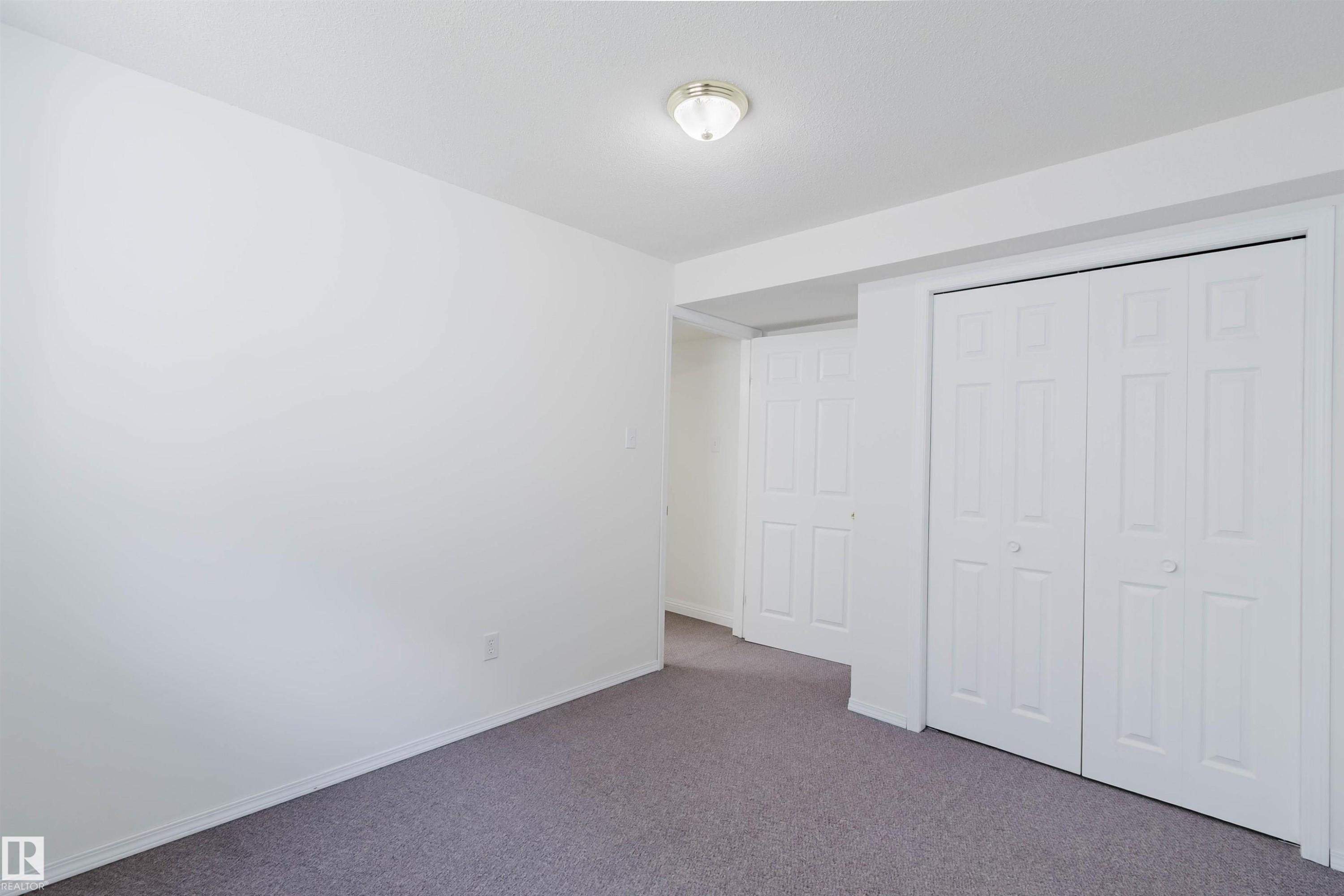 Room featuring grey carpet flooring and white walls - 13755 131B Avenue, Edmonton, AB - Indoor
