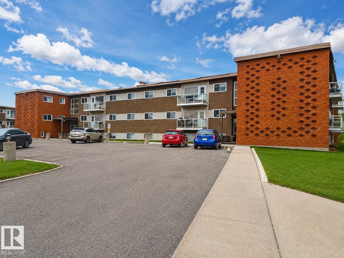 Multi-story residential building featuring brick and panel facades - 17 6215 98 Avenue, Edmonton, AB - Outdoor