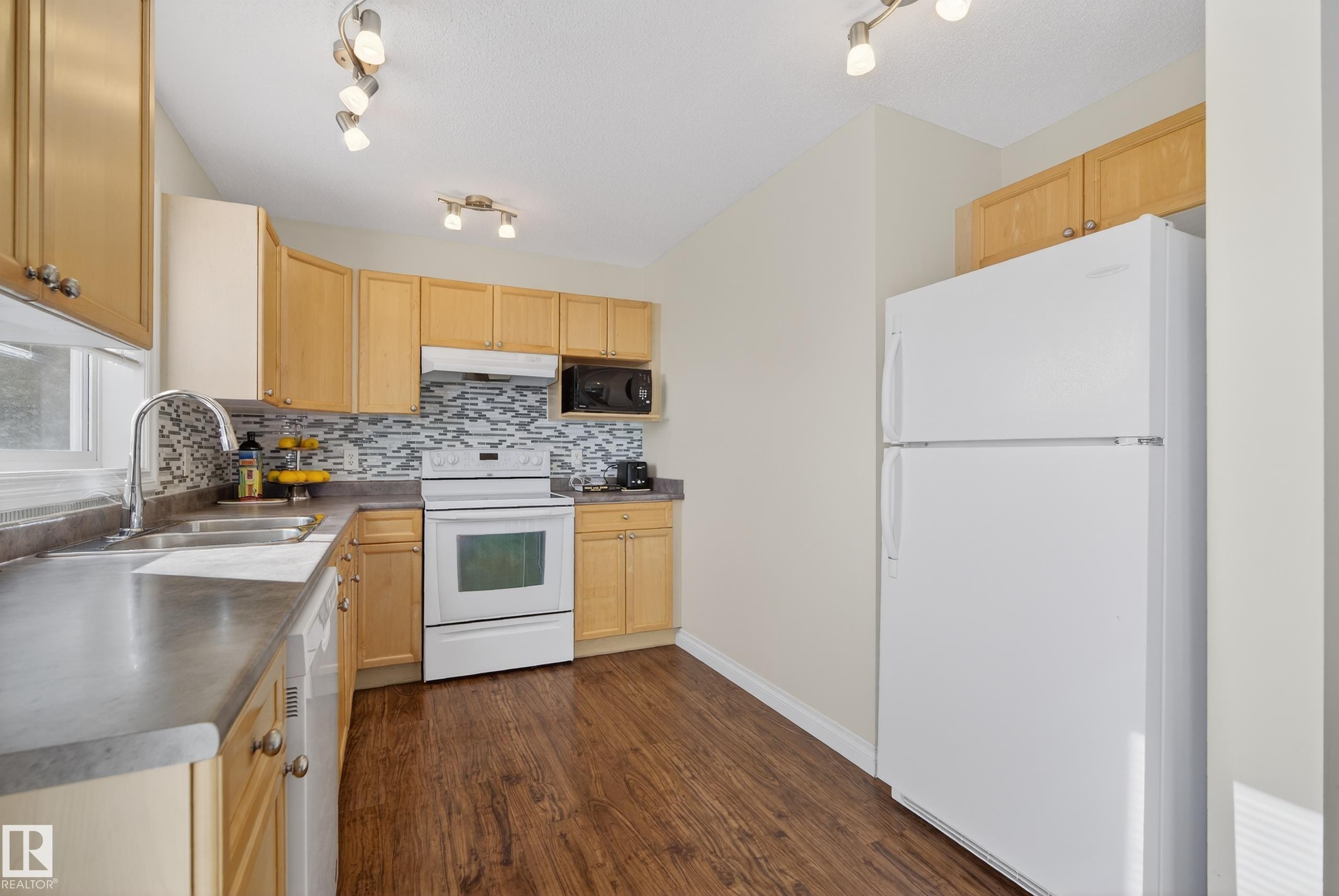 #88 12050 17 Av Sw, Edmonton, AB - Indoor Photo Showing Kitchen With Double Sink