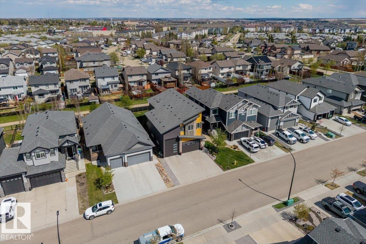 Contemporary residential neighborhood featuring diverse architectural styles and paved streets - 219 Cranberry Bend, Fort Saskatchewan, AB - Outdoor With View