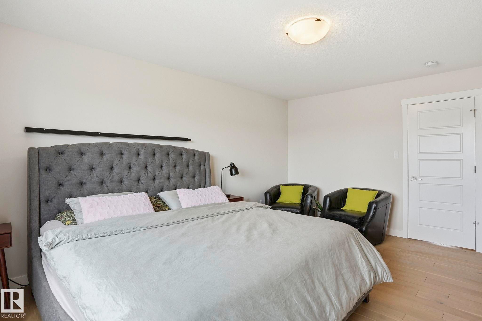 Bright room featuring light-toned walls and wood-finish flooring - 2116 159 Street, Edmonton, AB - Indoor Photo Showing Bedroom