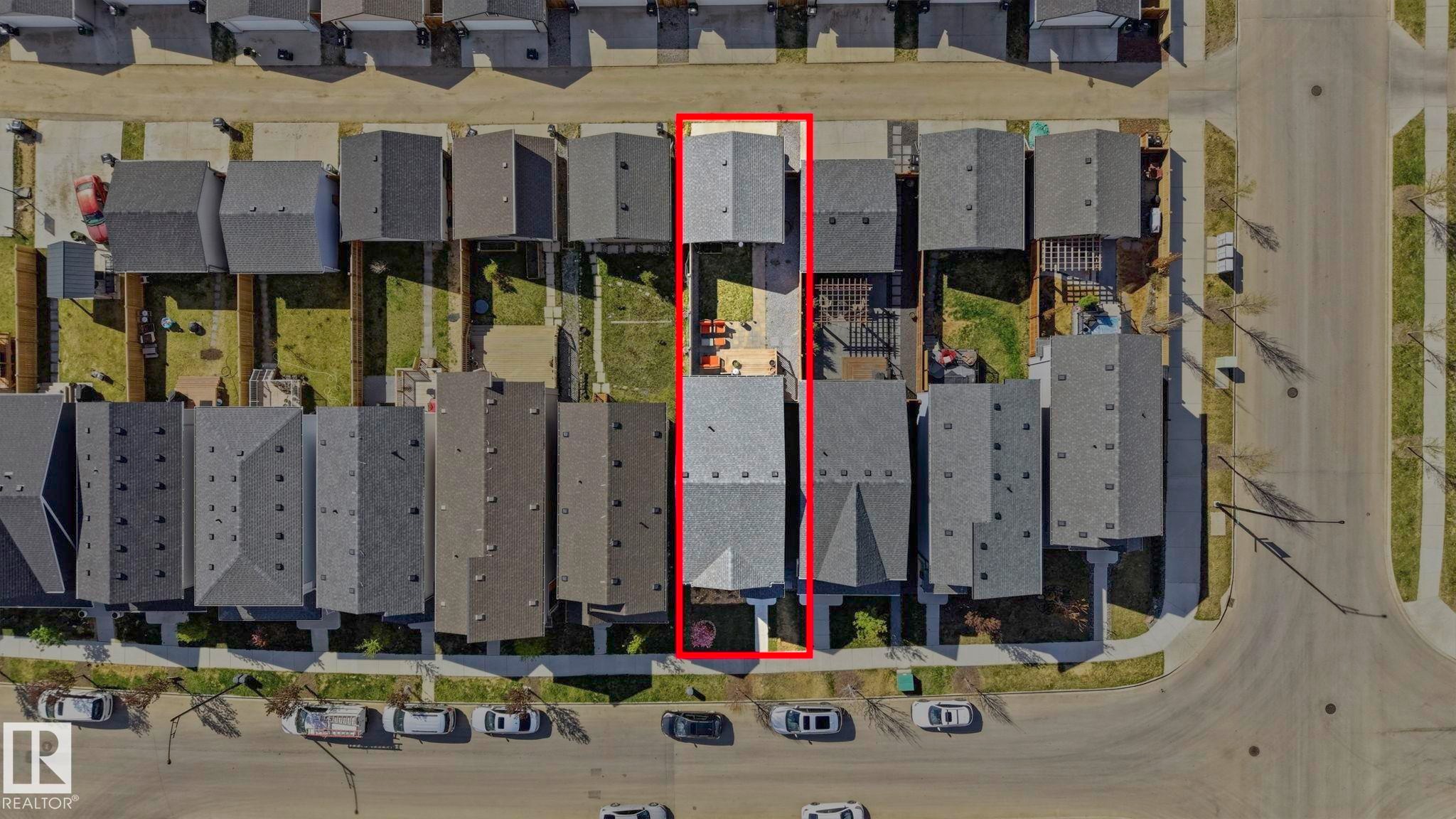 Aerial view highlighting a single-family residence with a gray shingle roof, a private backyard space, and proximity to street parking - 2116 159 Street, Edmonton, AB -