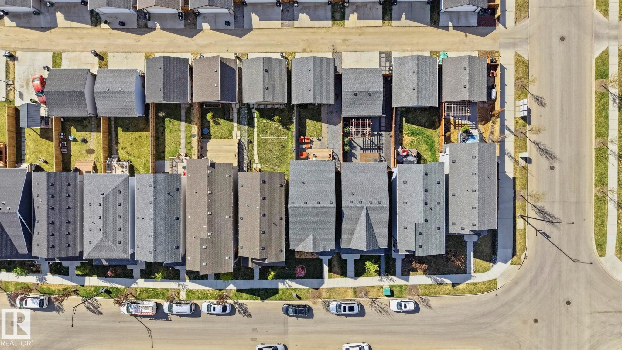 Row of residential properties featuring shingled roofs and private rear yards - 2116 159 Street, Edmonton, AB - Other