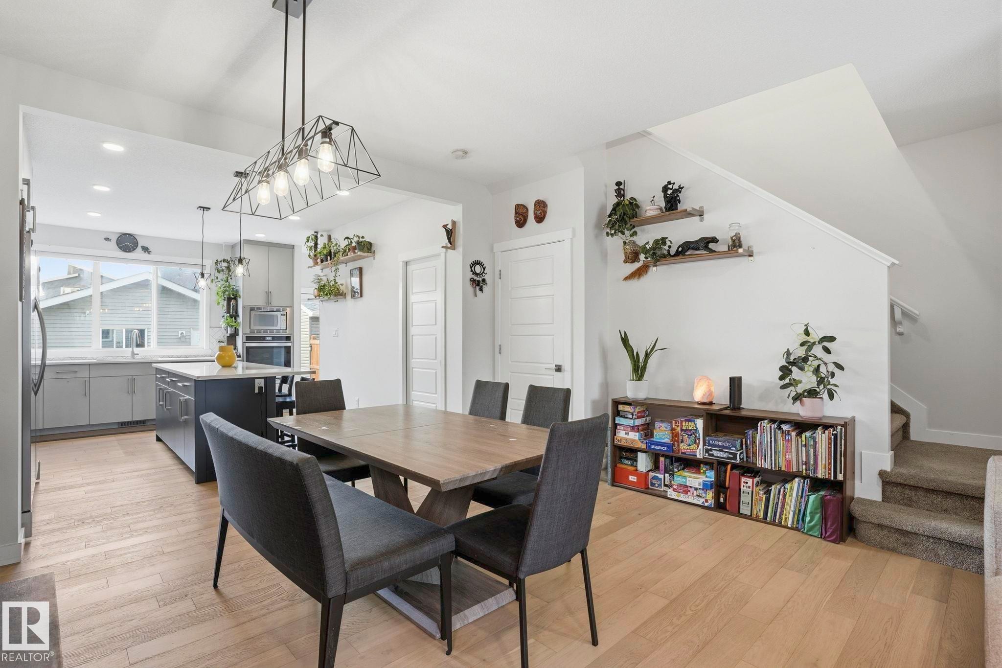 Open-concept living space with light wood-finish flooring - 2116 159 Street, Edmonton, AB - Indoor Photo Showing Dining Room