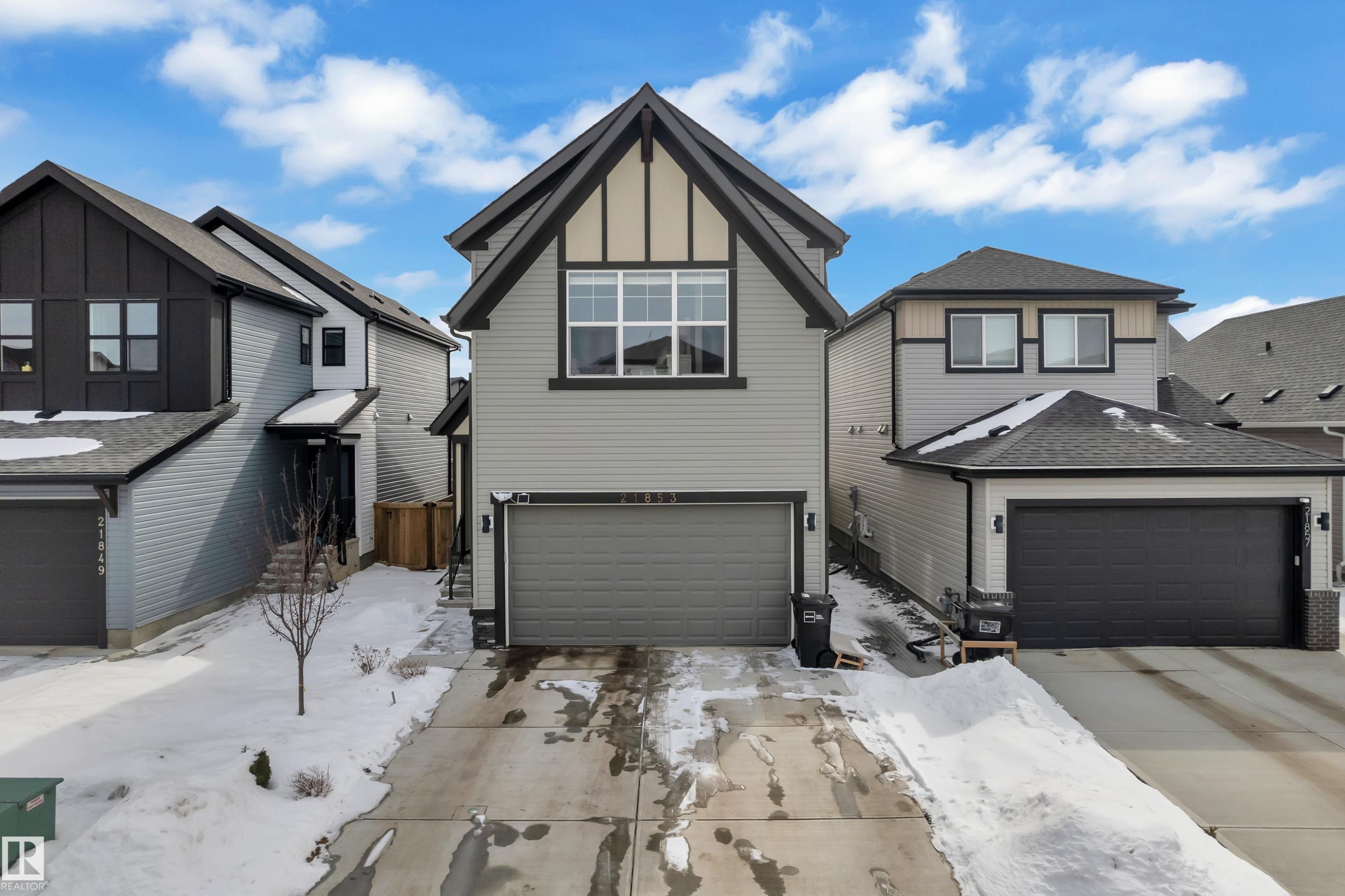 The property features a two-story design with light gray siding and dark gray trim accents - 21853 98A Avenue, Edmonton, AB - Outdoor With Facade
