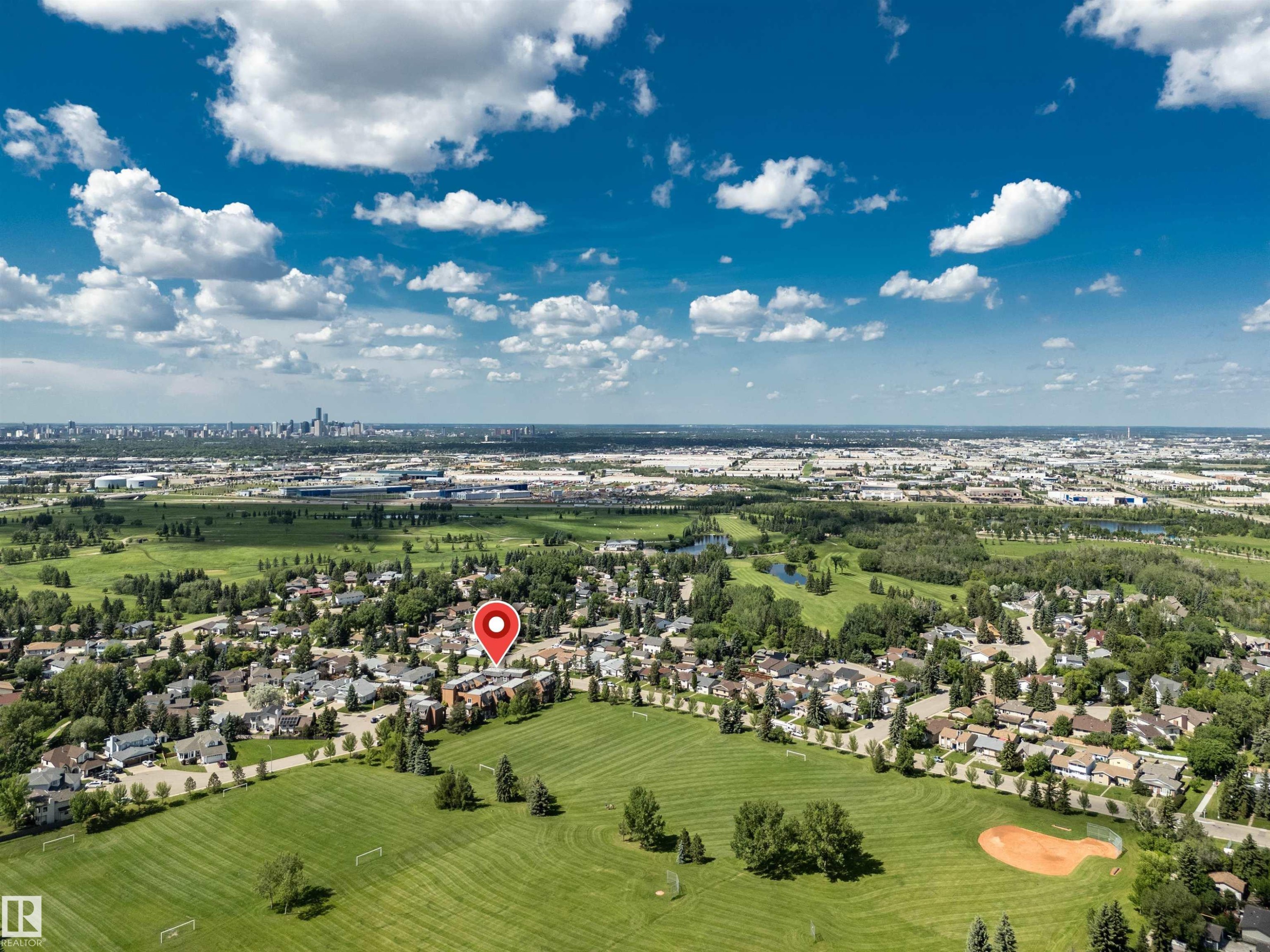 Aerial perspective showcasing a residential area with extensive green spaces - 5953 40 Avenue, Edmonton, AB