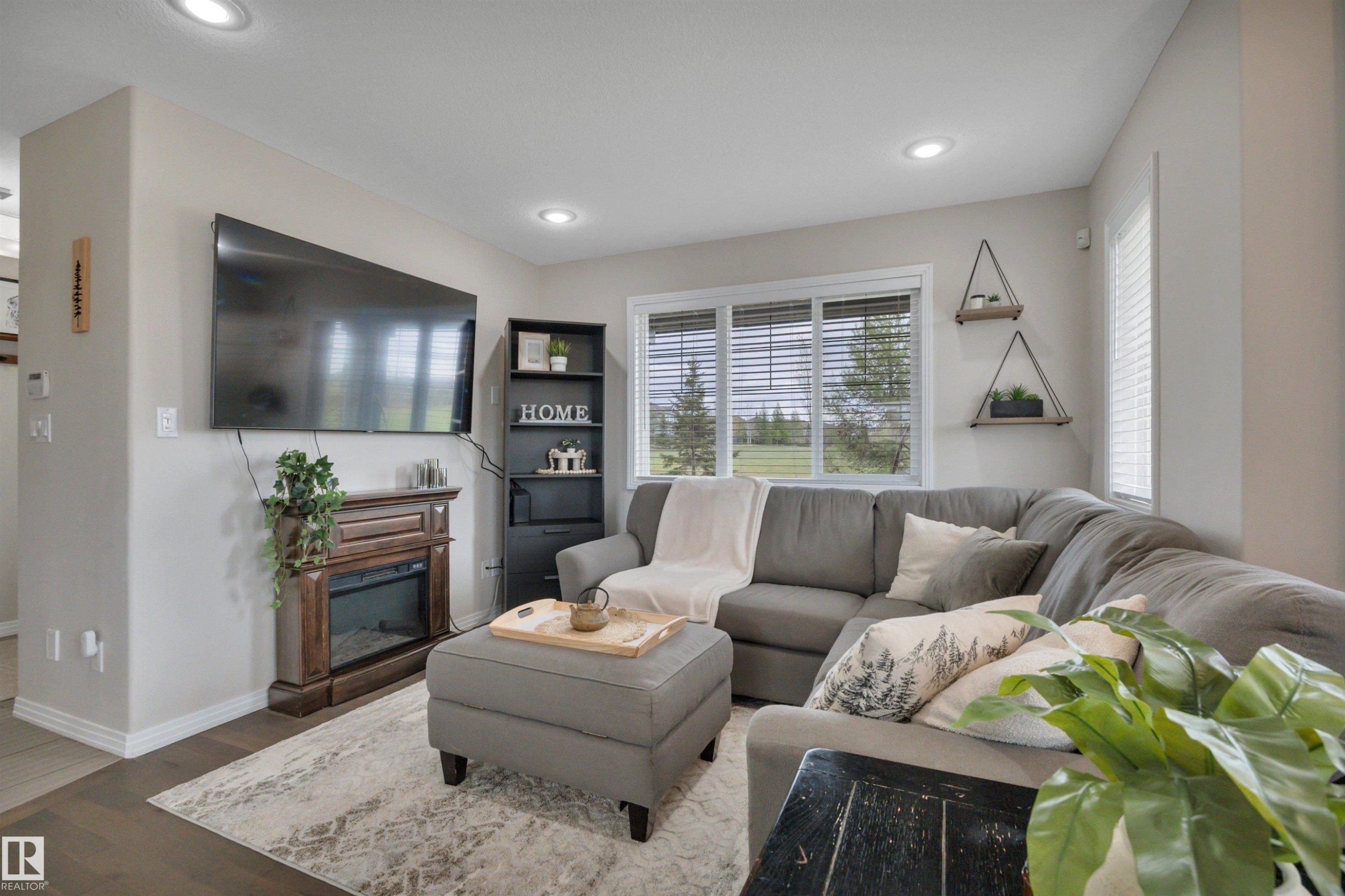 36 Spruce Boulevard, Leduc, AB - Indoor Photo Showing Living Room With Fireplace