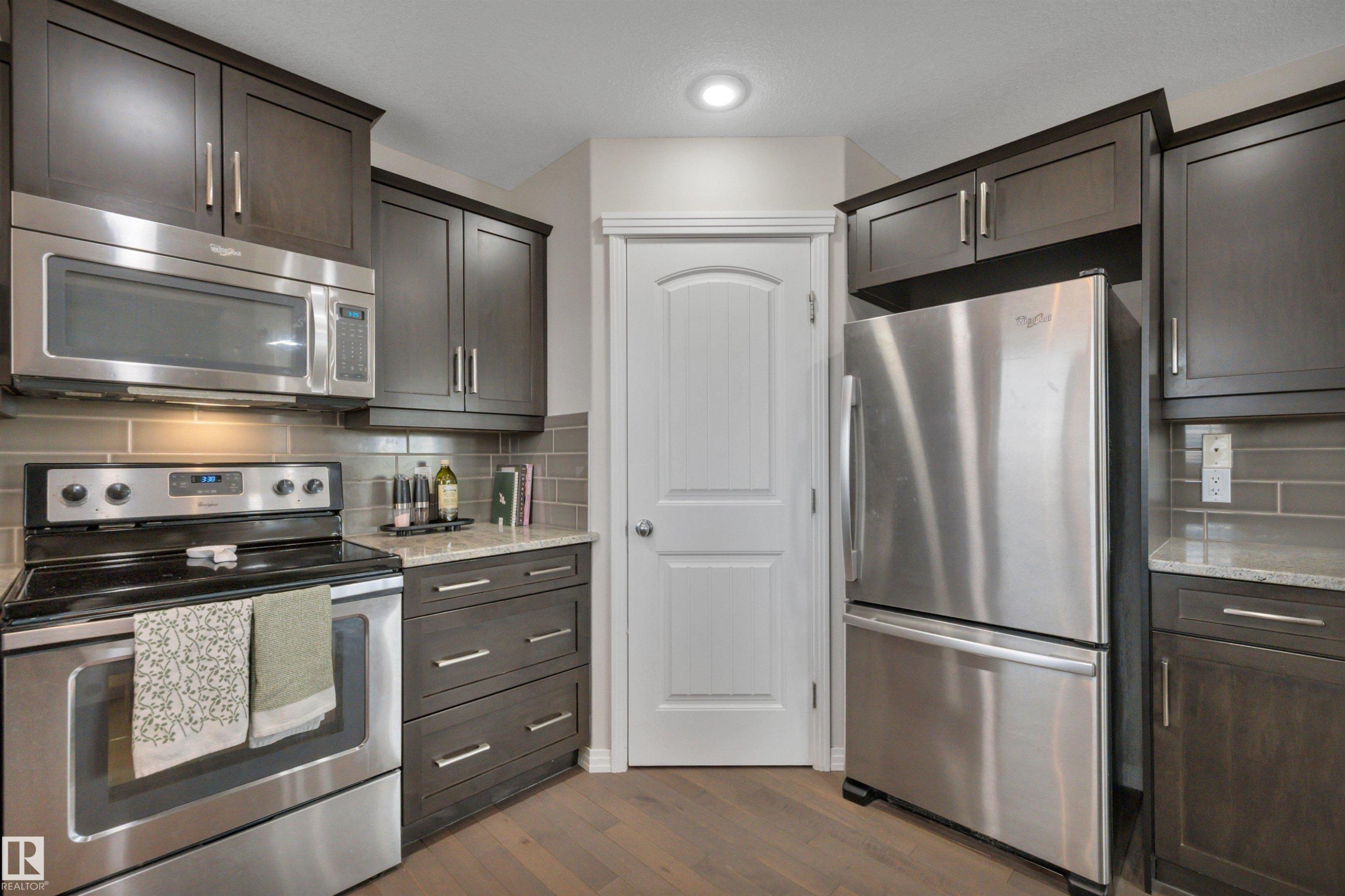 36 Spruce Boulevard, Leduc, AB - Indoor Photo Showing Kitchen With Stainless Steel Kitchen With Upgraded Kitchen