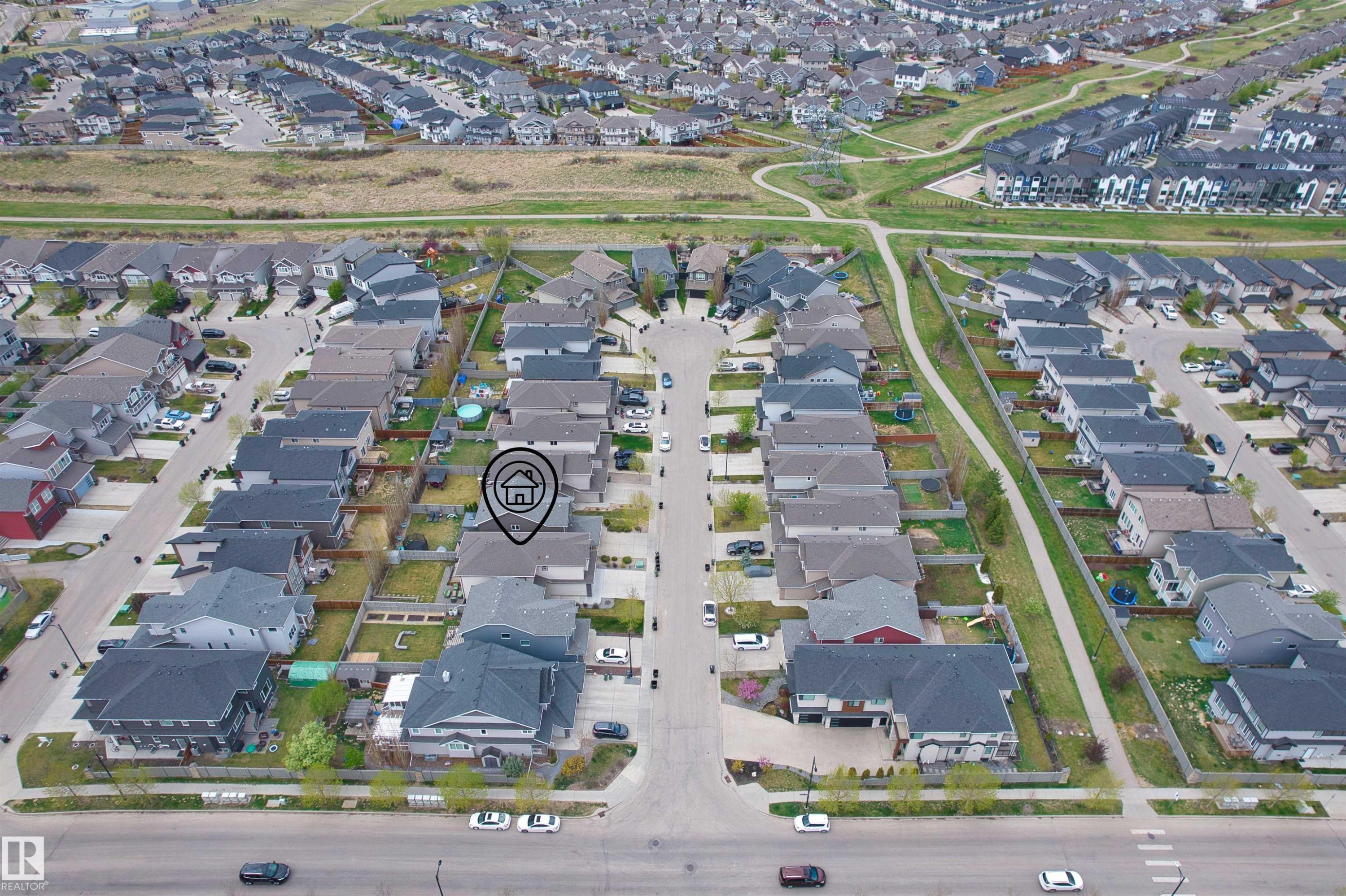 Aerial perspective of a residential neighborhood featuring a tree-lined street and a pedestrian pathway system - 3807 Claxton Close, Edmonton, AB - With View