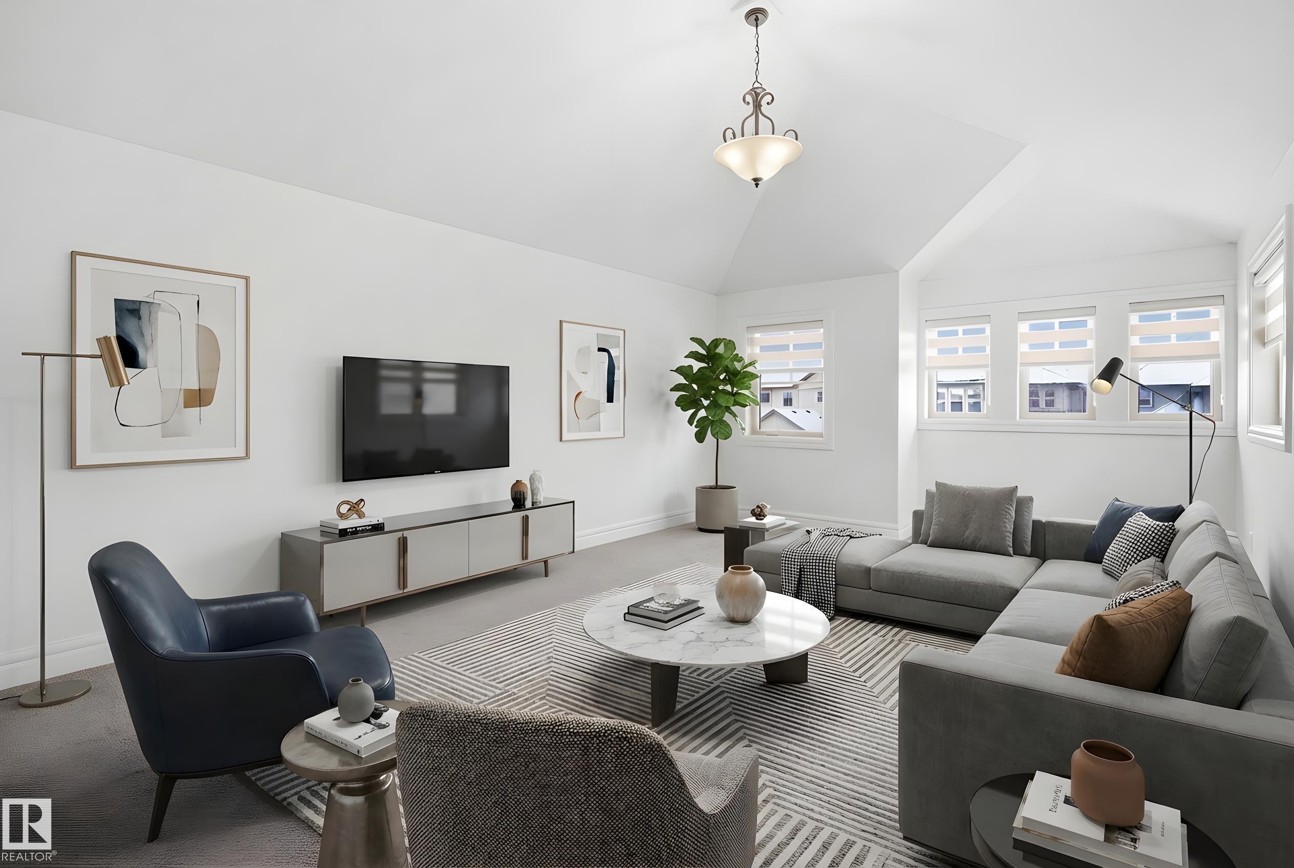 A large bonus room with tons of natural sunlight - 469 Ainslie Crescent Sw, Edmonton, AB - Indoor Photo Showing Living Room