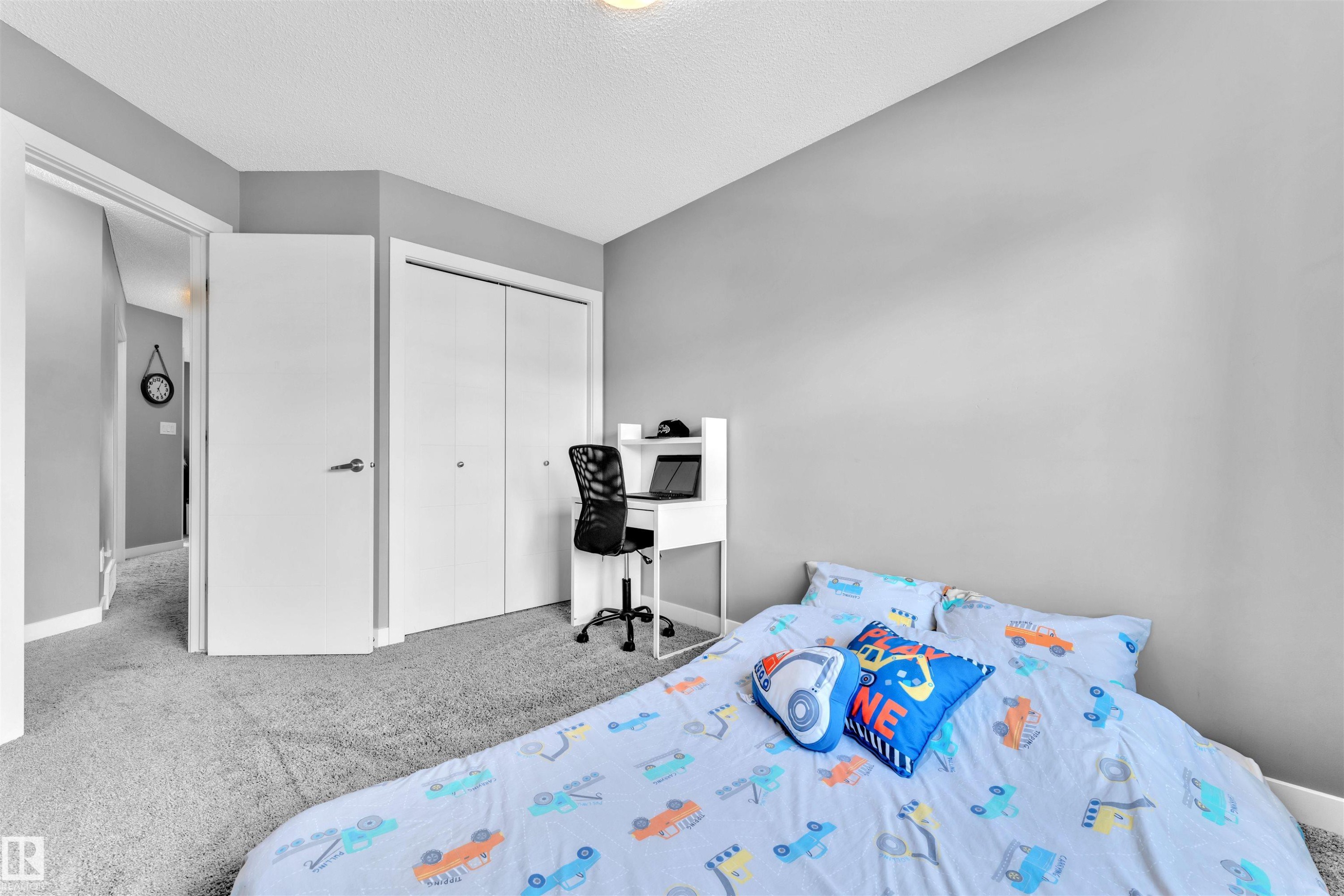 This room features light grey walls and light grey carpet - 8108 217 Street, Edmonton, AB - Indoor Photo Showing Bedroom
