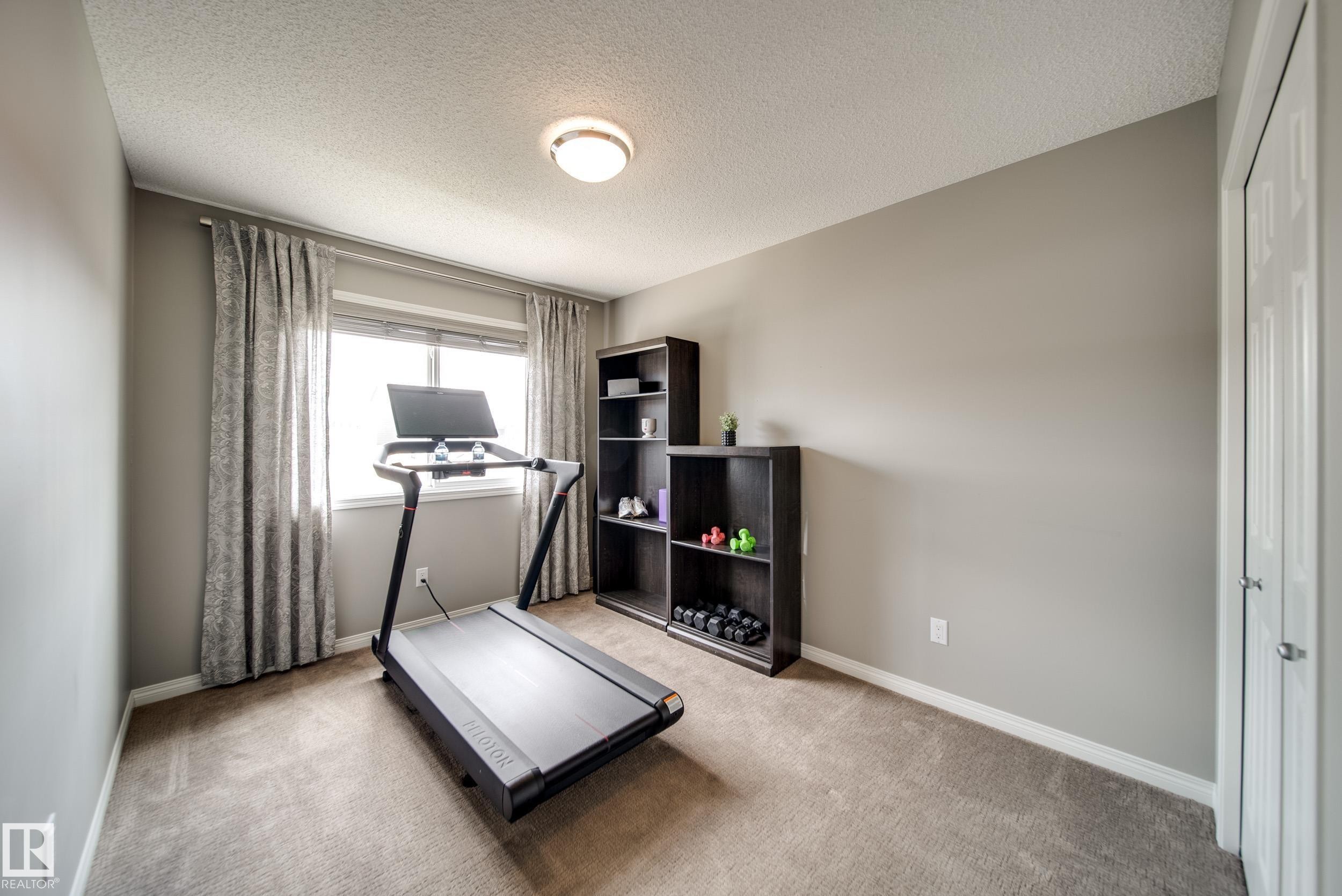 3365 Orchards Link, Edmonton, AB - Indoor Photo Showing Gym Room
