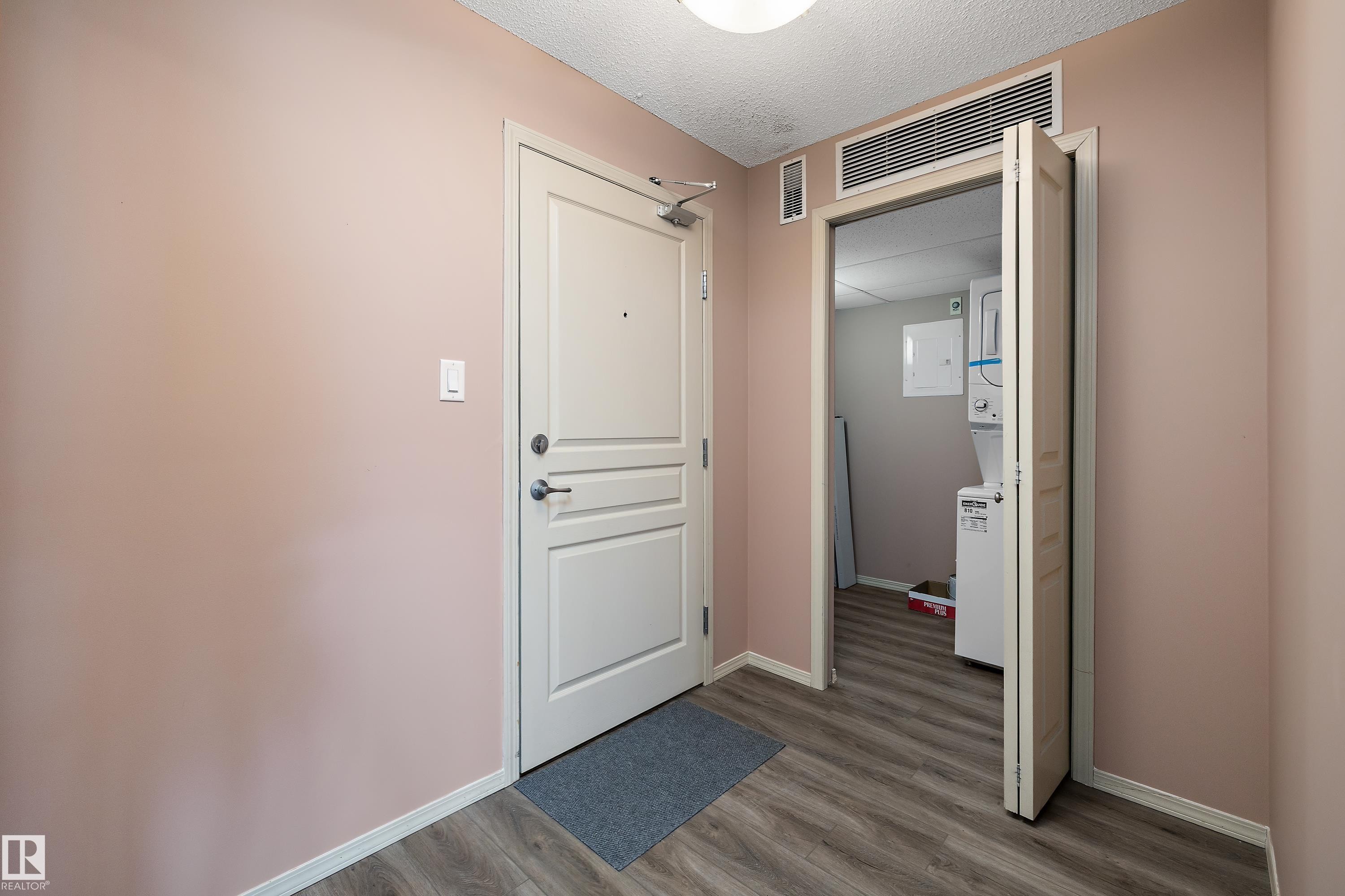 Entryway featuring wood-finish flooring and a neutral color palette - 406 16035 132 Street, Edmonton, AB - Indoor Photo Showing Other Room