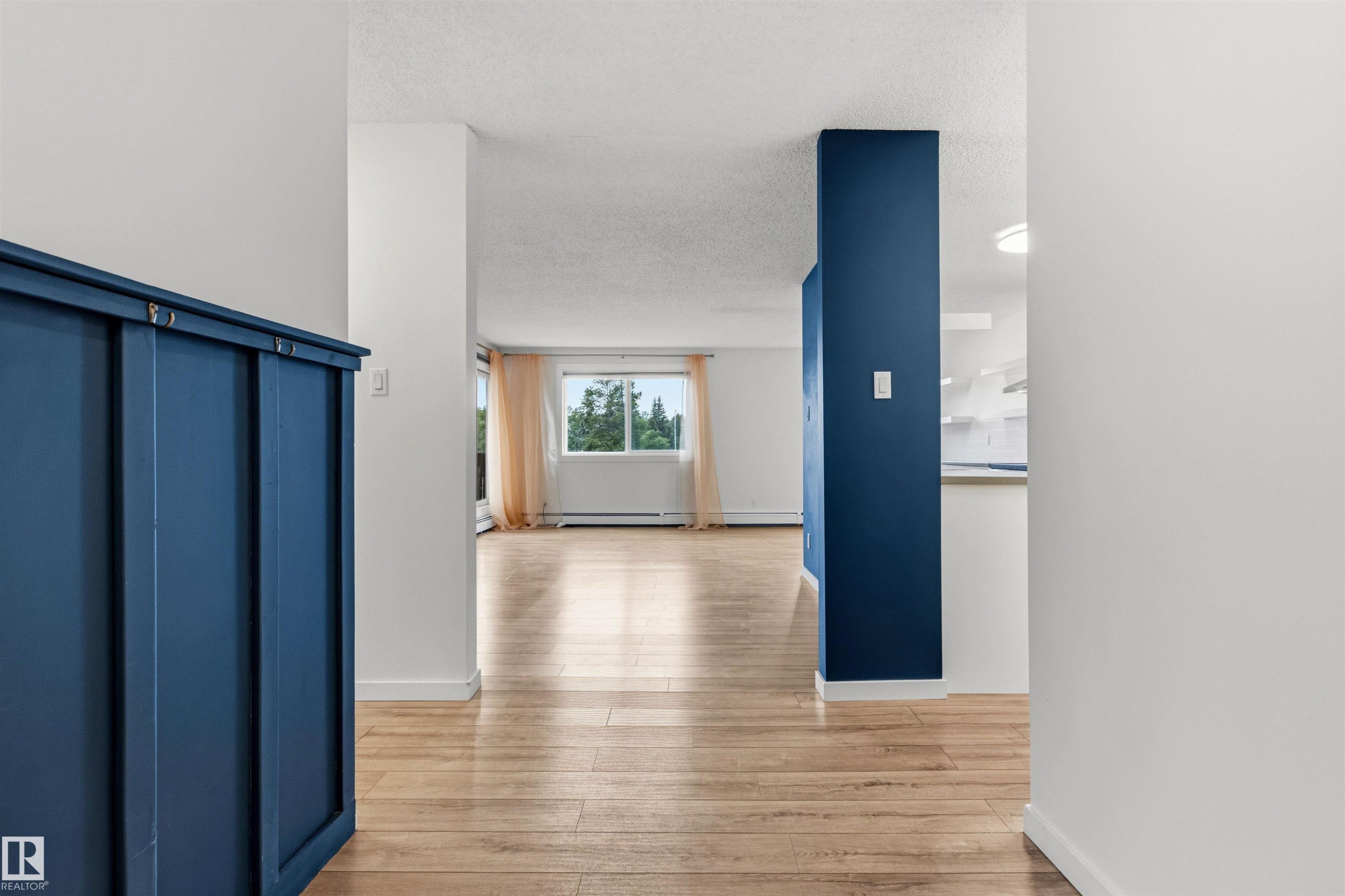 Open concept main living area featuring light wood-finish flooring - 217 14819 51 Avenue, Edmonton, AB