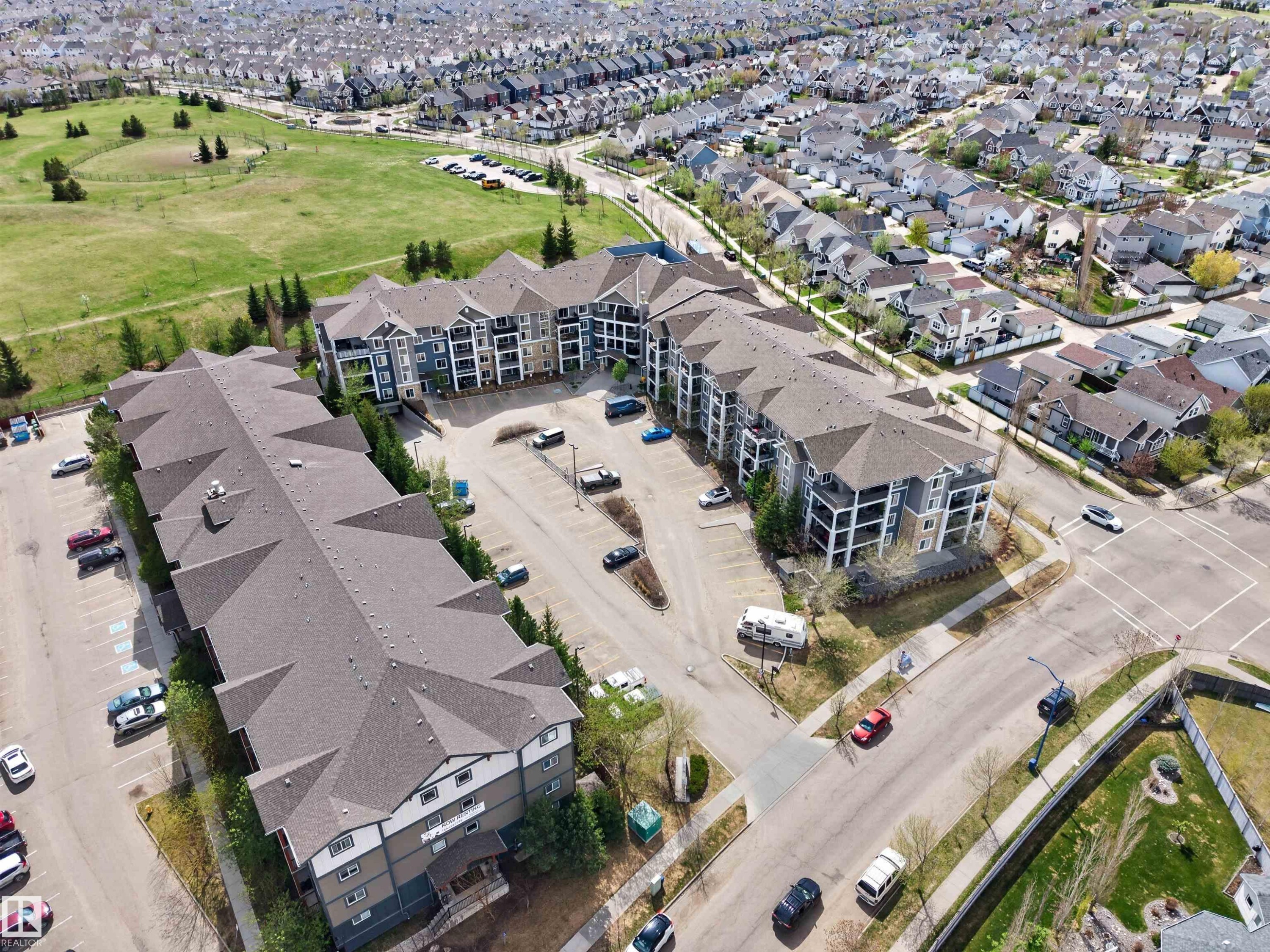 Aerial perspective of multi-story residential buildings featuring gabled roofs and private balconies - 215 6084 Stanton Drive, Edmonton, AB - Outdoor With View
