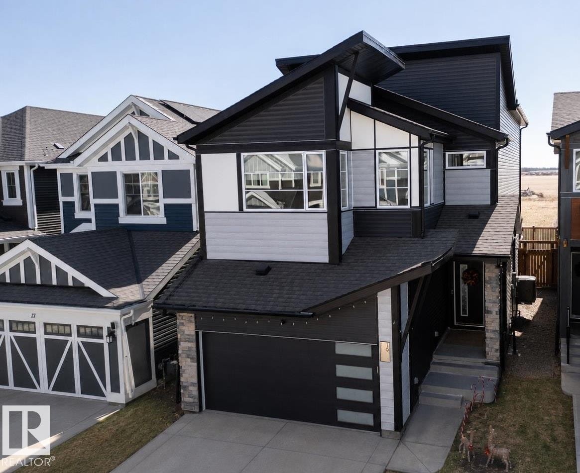 Modern two-story residence featuring a striking black and gray exterior with white trim - 19 Sturtz Place, Leduc, AB - Outdoor