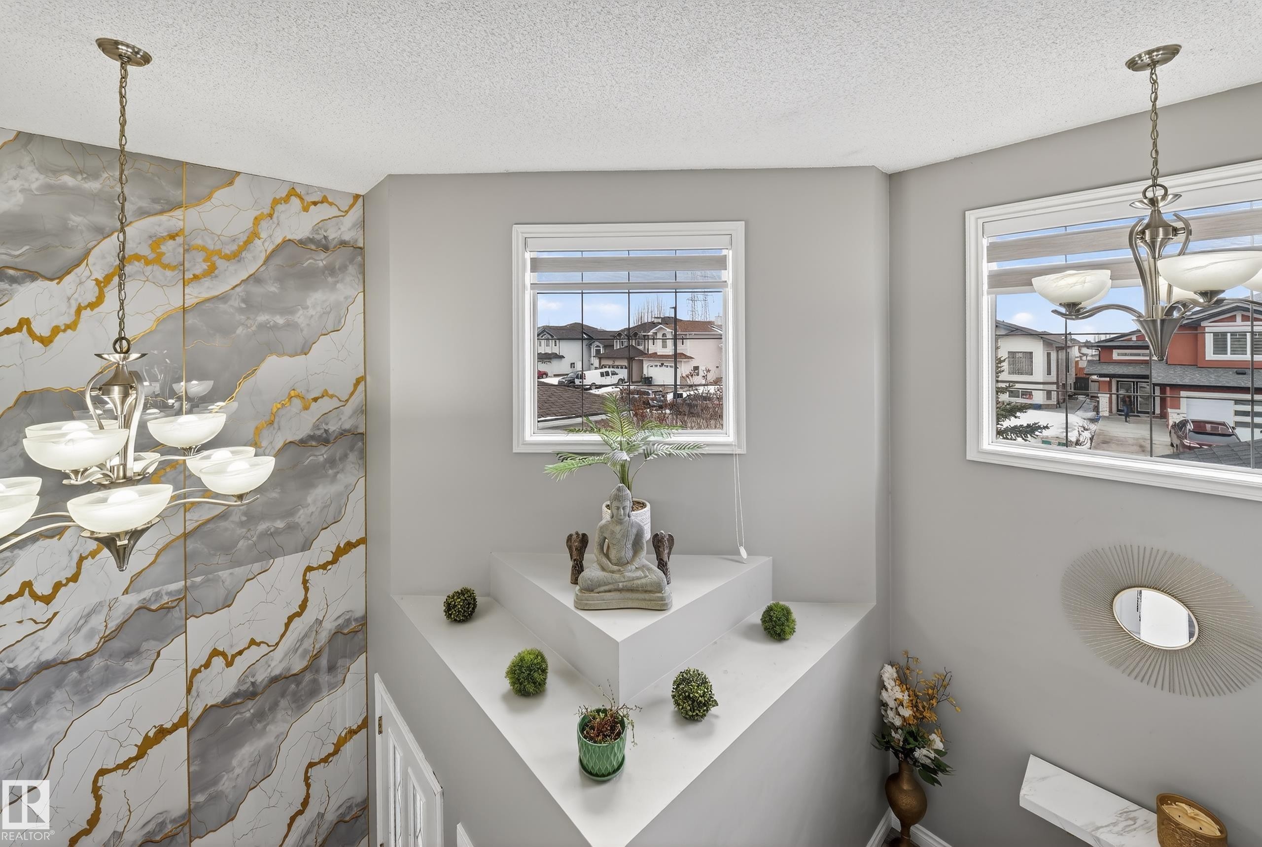 This property features two windows providing views of the surrounding neighborhood and a decorative wall with a gold and grey marble-like pattern - 3517 25 Street, Edmonton, AB - Indoor Photo Showing Bathroom