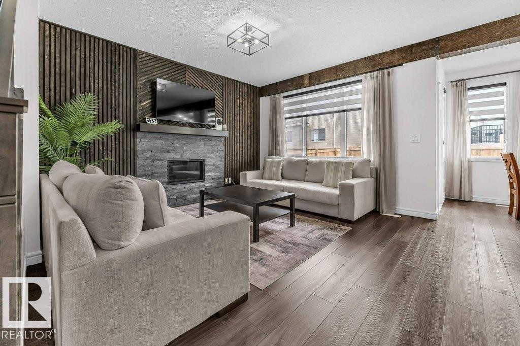 2107 14 Avenue, Edmonton, AB - Indoor Photo Showing Living Room With Fireplace