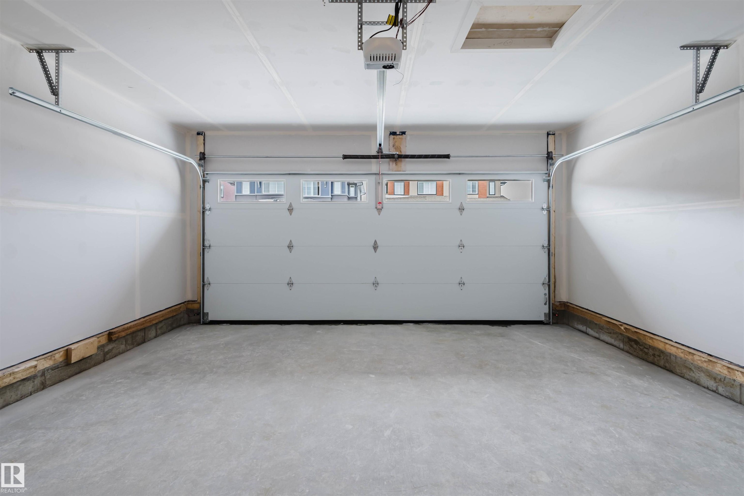 8243 Kiriak Loop Sw, Edmonton, AB - Indoor Photo Showing Garage
