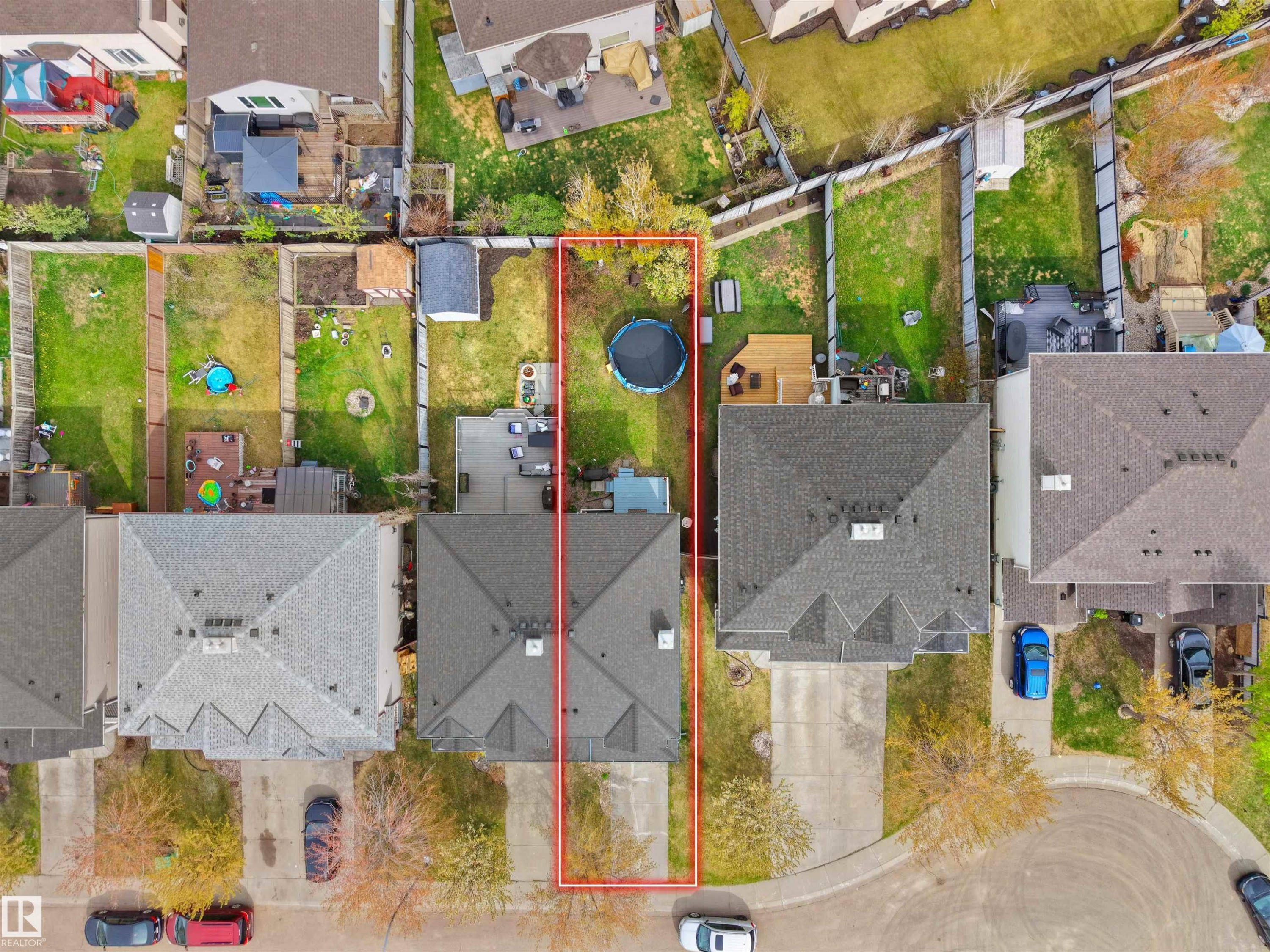 Aerial perspective showcasing the property's footprint, featuring a detached single-family residence with a gray shingle roof - 16121 131A Street, Edmonton, AB - With View