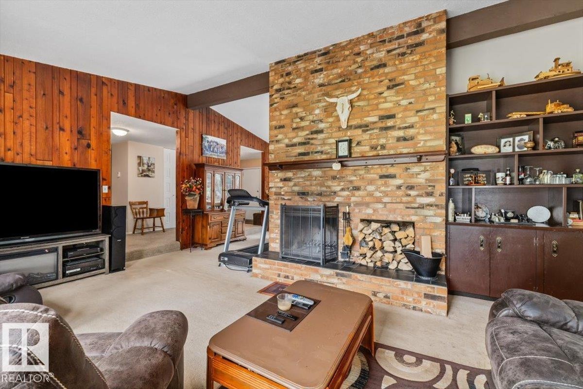 4411 209 Street Nw, Edmonton, AB - Indoor Photo Showing Living Room With Fireplace