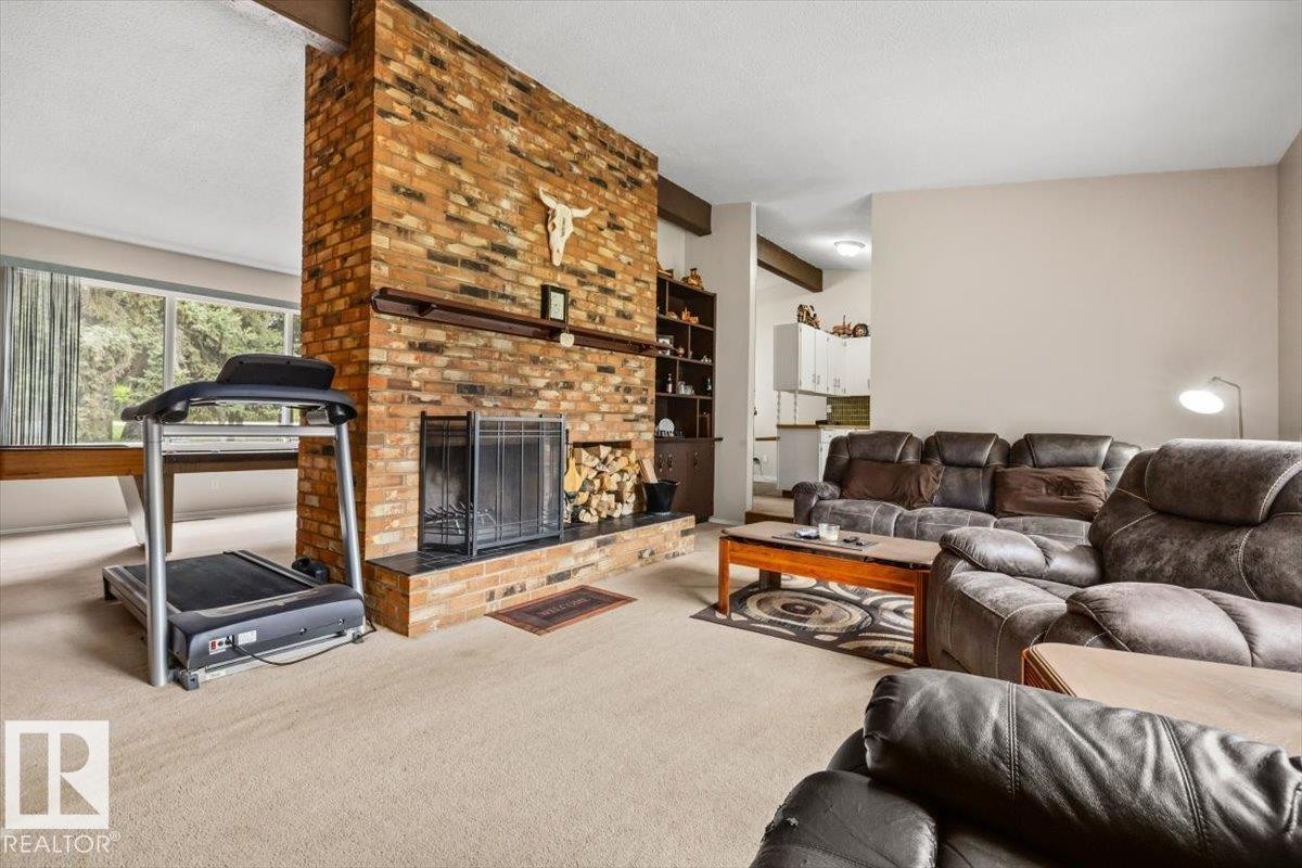 4411 209 Street Nw, Edmonton, AB - Indoor Photo Showing Living Room With Fireplace