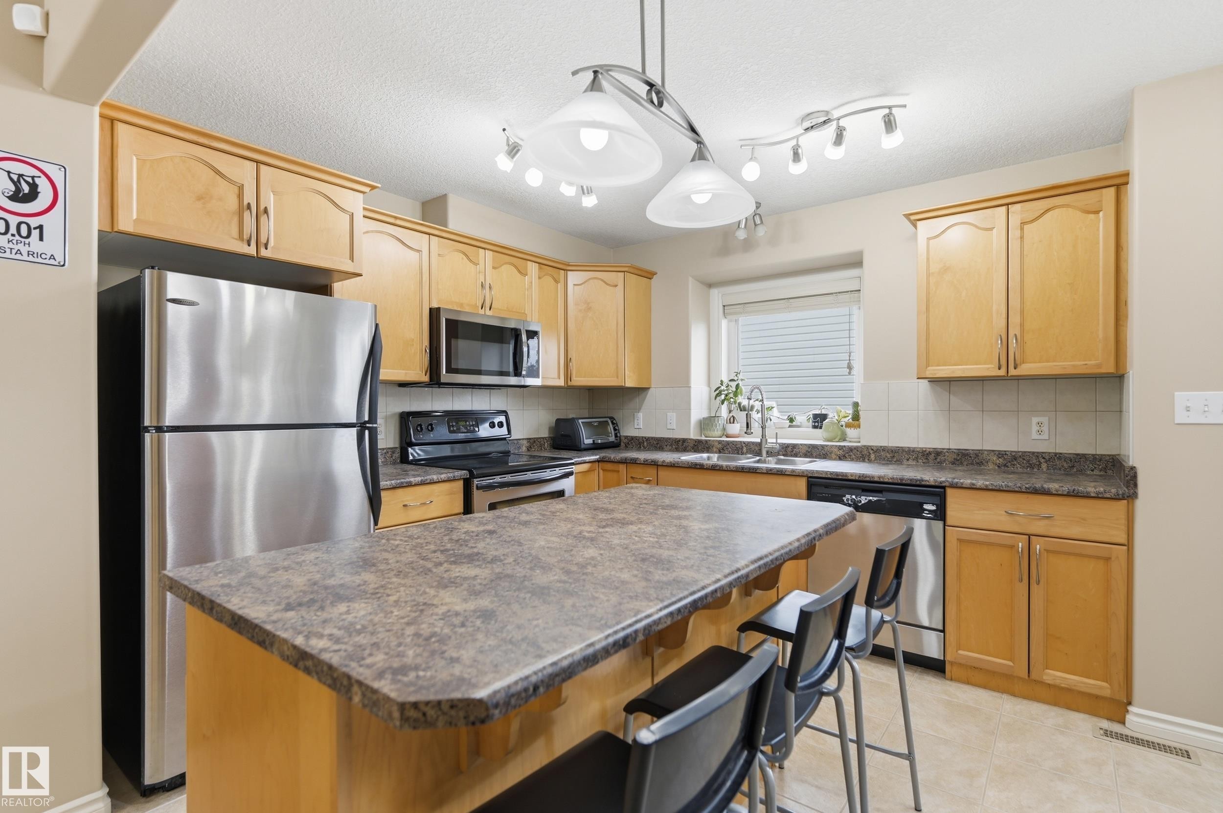 11337 76 Avenue Nw, Edmonton, AB - Indoor Photo Showing Kitchen With Stainless Steel Kitchen With Double Sink