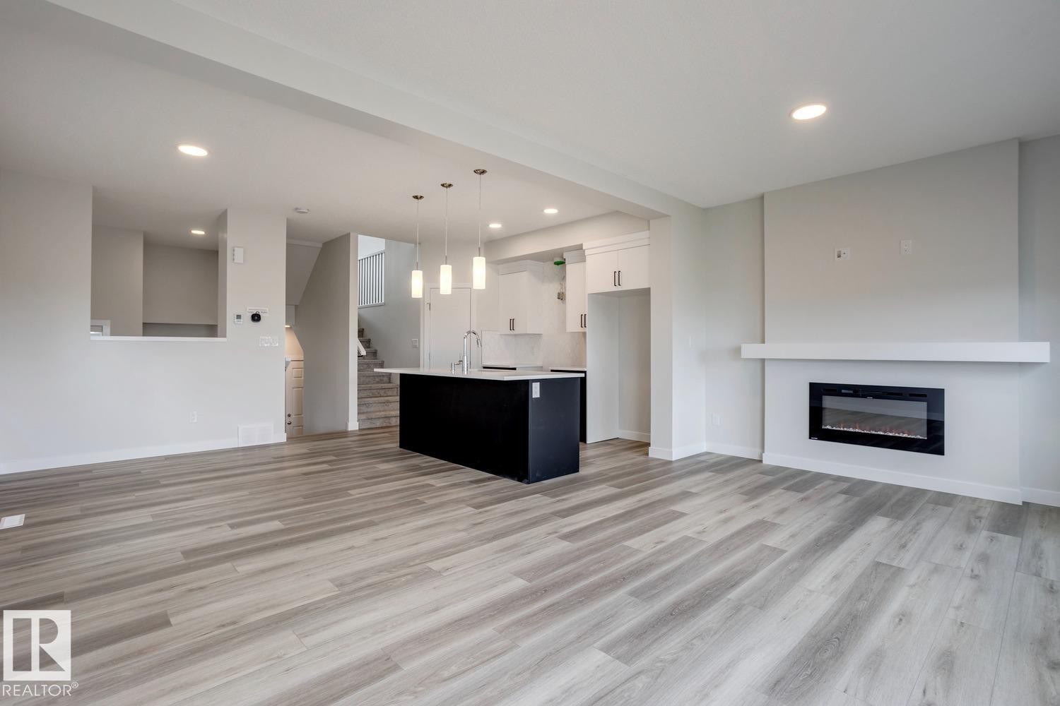 308 Brae Way, Leduc, AB - Indoor Photo Showing Living Room With Fireplace