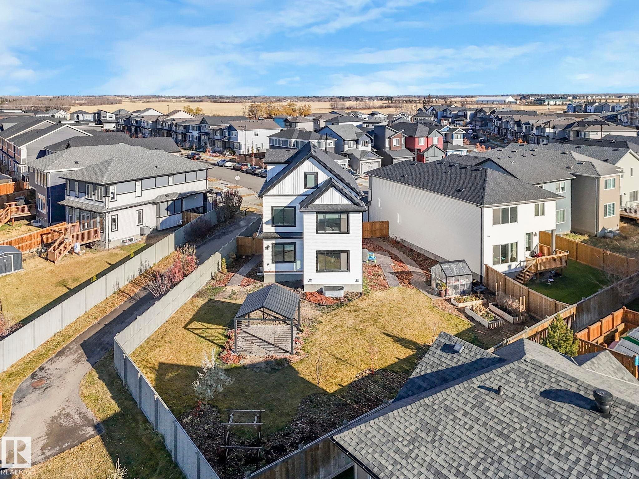Contemporary two-story residence with white siding and black trim accents - 6613 62 Avenue, Beaumont, AB - Outdoor