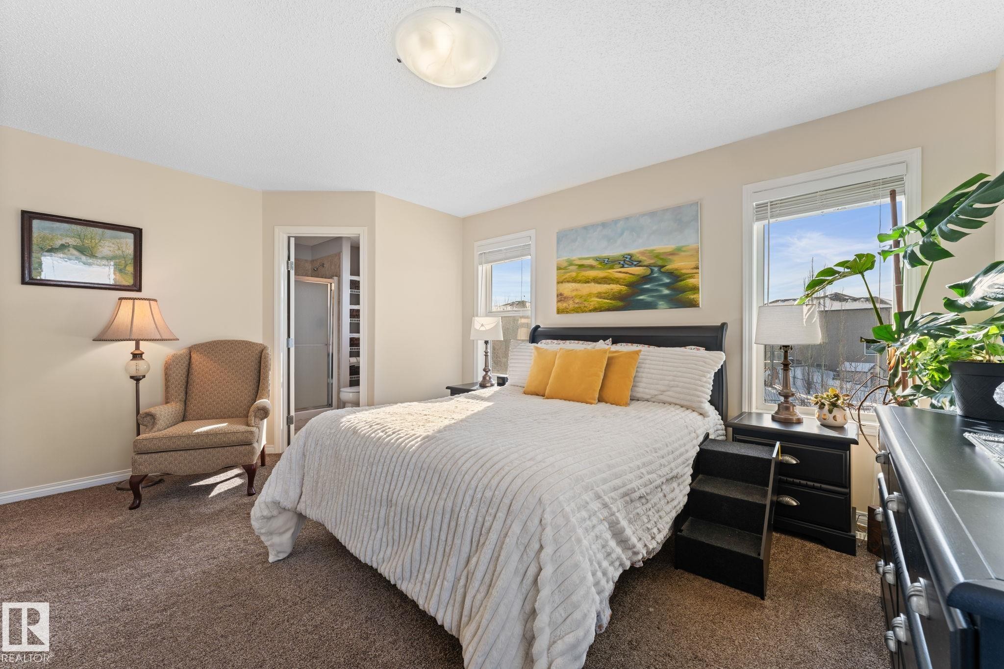 Carpeted bedroom with neutral wall tones - 112 Lakeland Point(E), Beaumont, AB - Indoor Photo Showing Bedroom