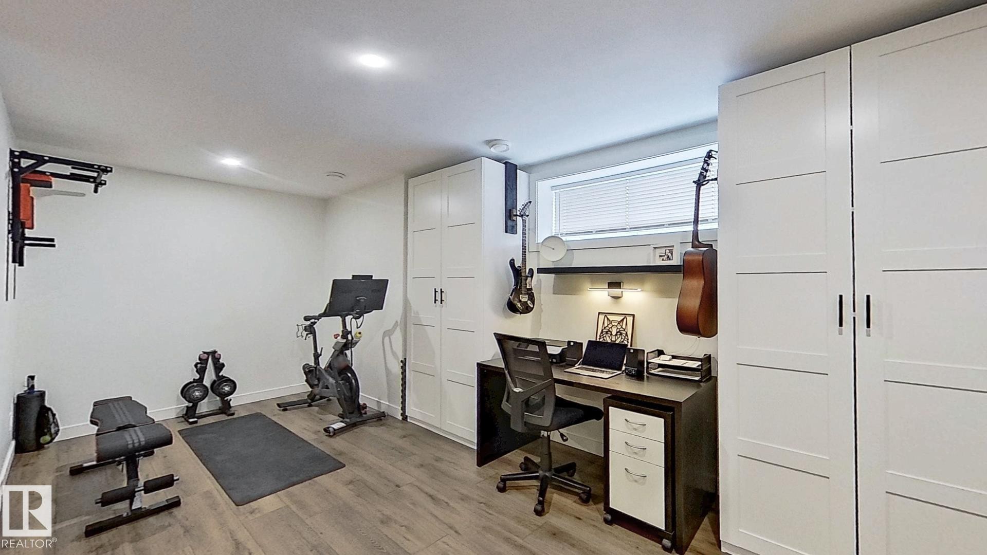 37 Emberside Link, Cochrane, AB - Indoor Photo Showing Gym Room