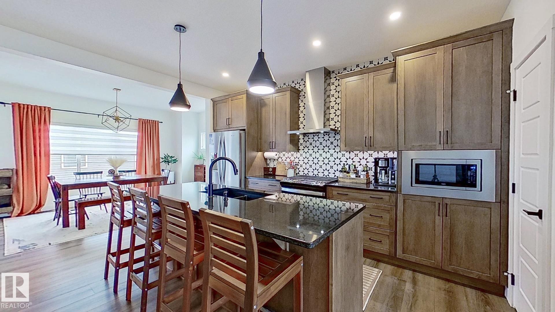37 Emberside Link, Cochrane, AB - Indoor Photo Showing Kitchen With Upgraded Kitchen