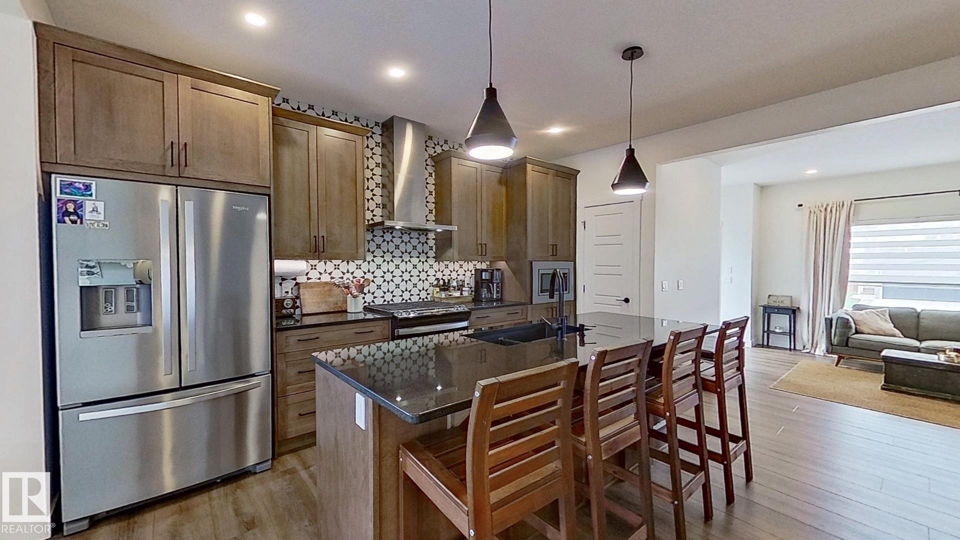 37 Emberside Link, Cochrane, AB - Indoor Photo Showing Kitchen With Upgraded Kitchen