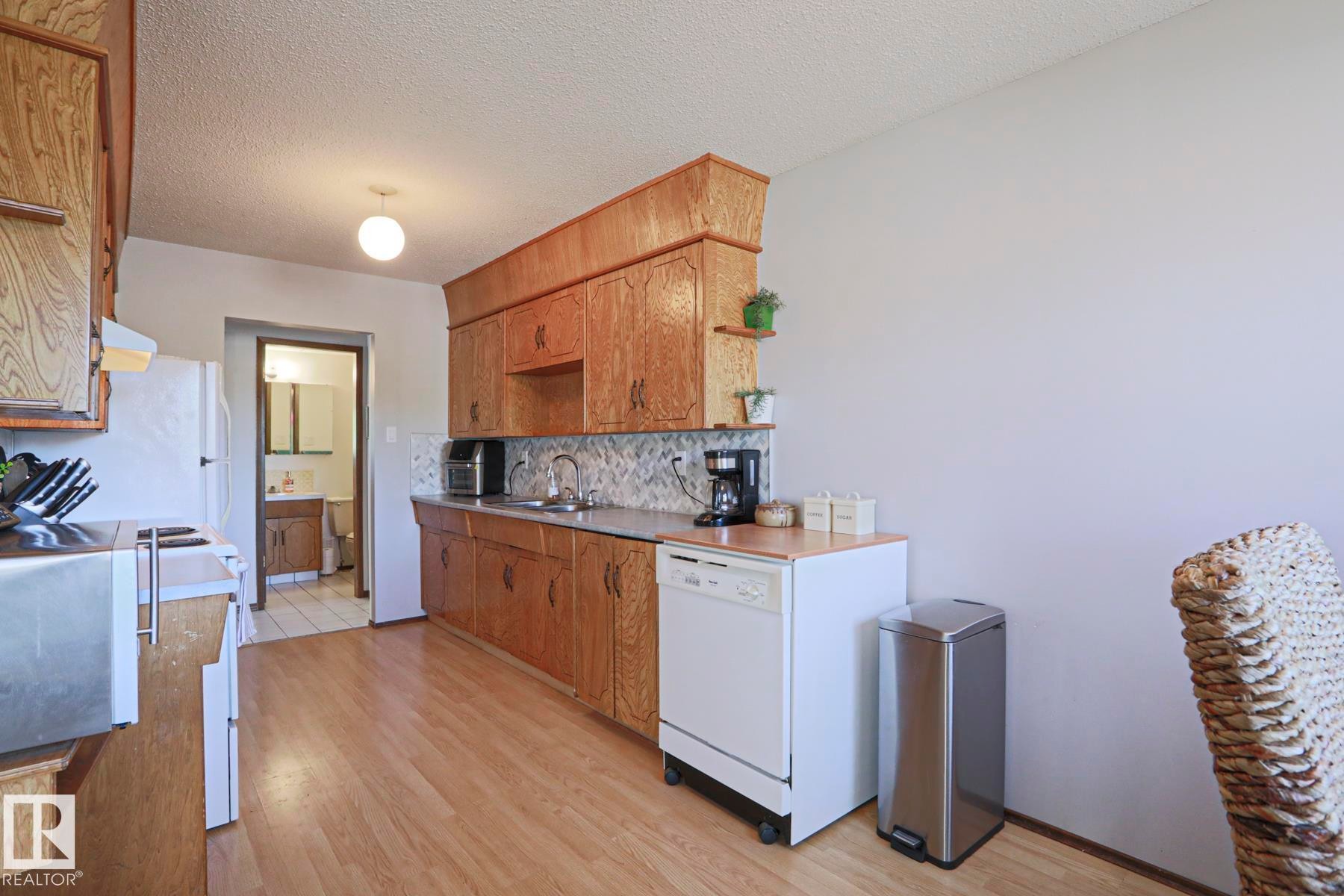 9324 80 Avenue, Edmonton, AB - Indoor Photo Showing Kitchen With Double Sink