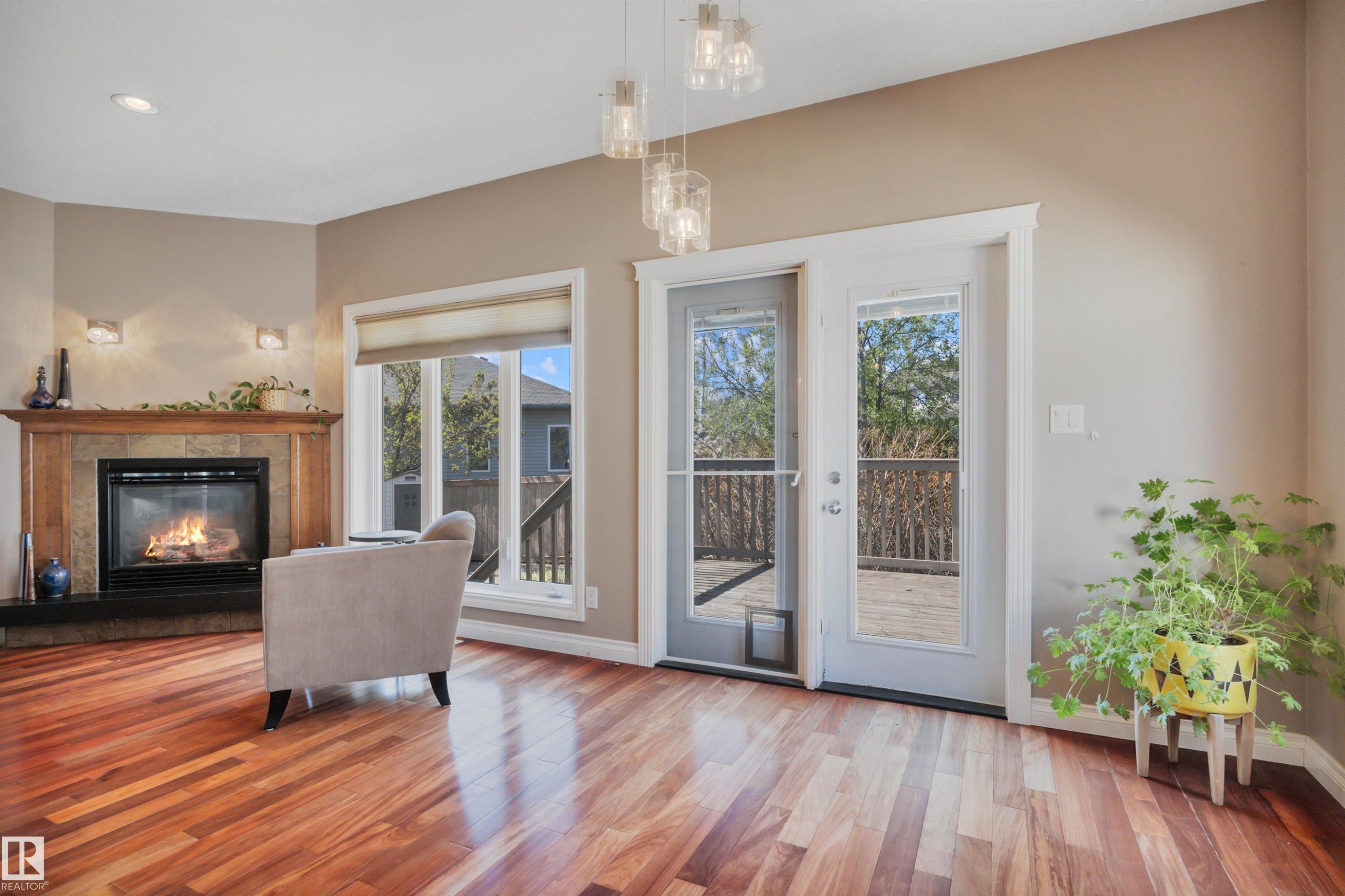 59 Wilkinson Place, Leduc, AB - Indoor Photo Showing Living Room With Fireplace