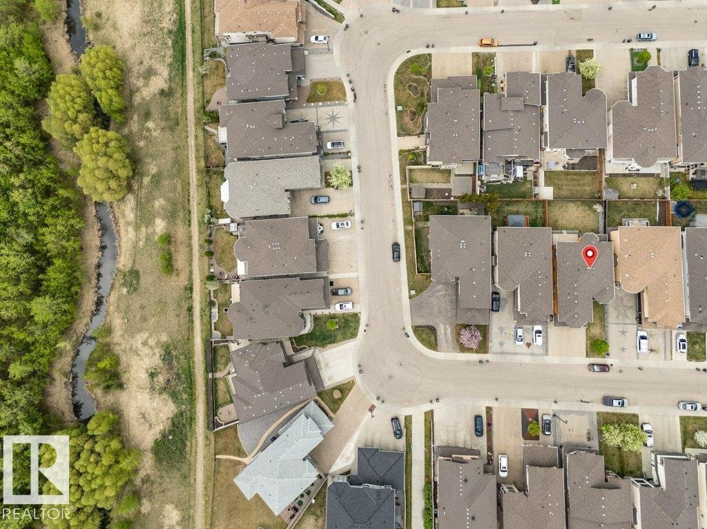 Aerial perspective highlighting residential properties bordering a natural creek and mature tree line - 816 Wildwood Crescent, Edmonton, AB - Other