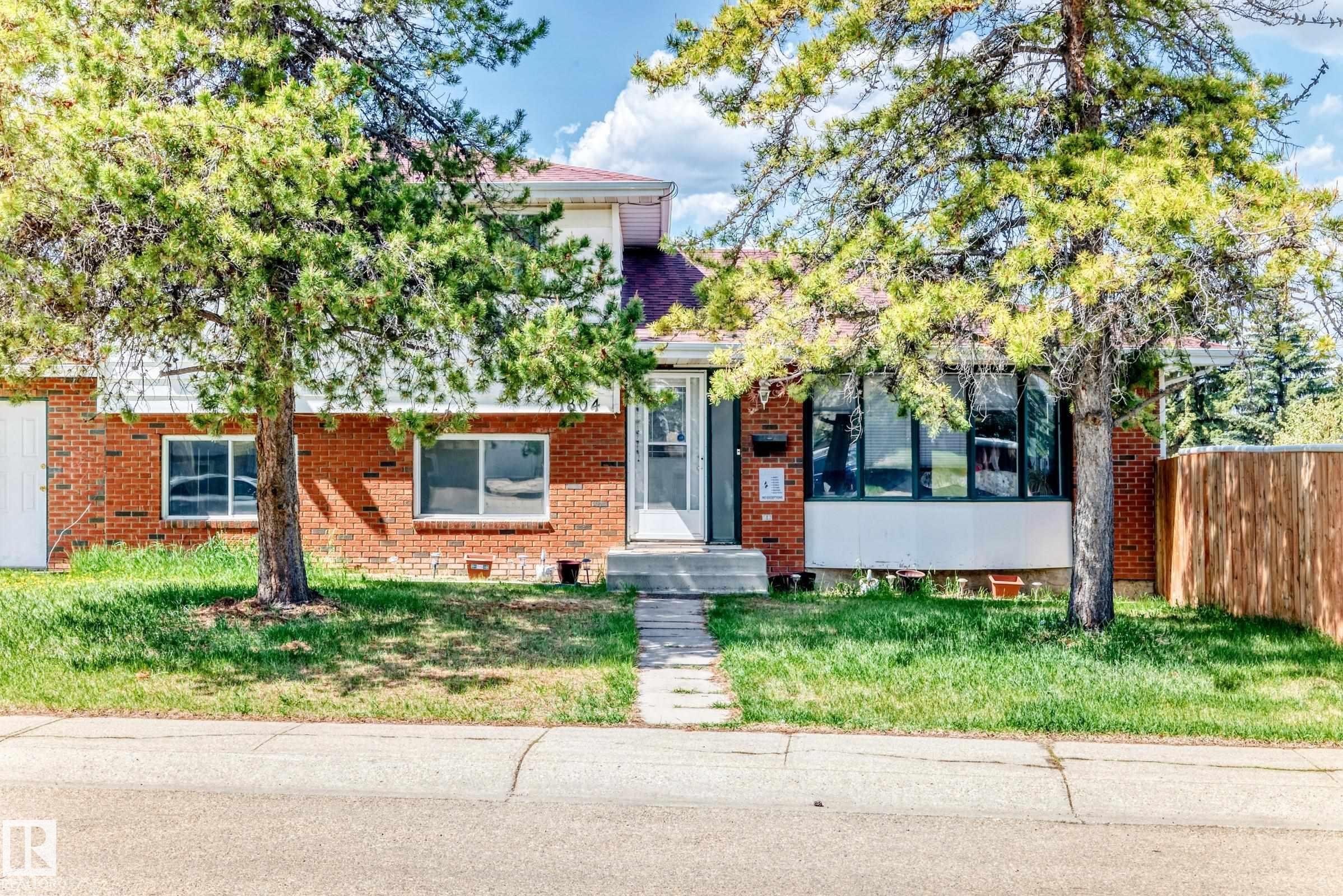 Brick exterior featuring a front entrance with a concrete path - 1804 51 Street Nw, Edmonton, AB - Outdoor