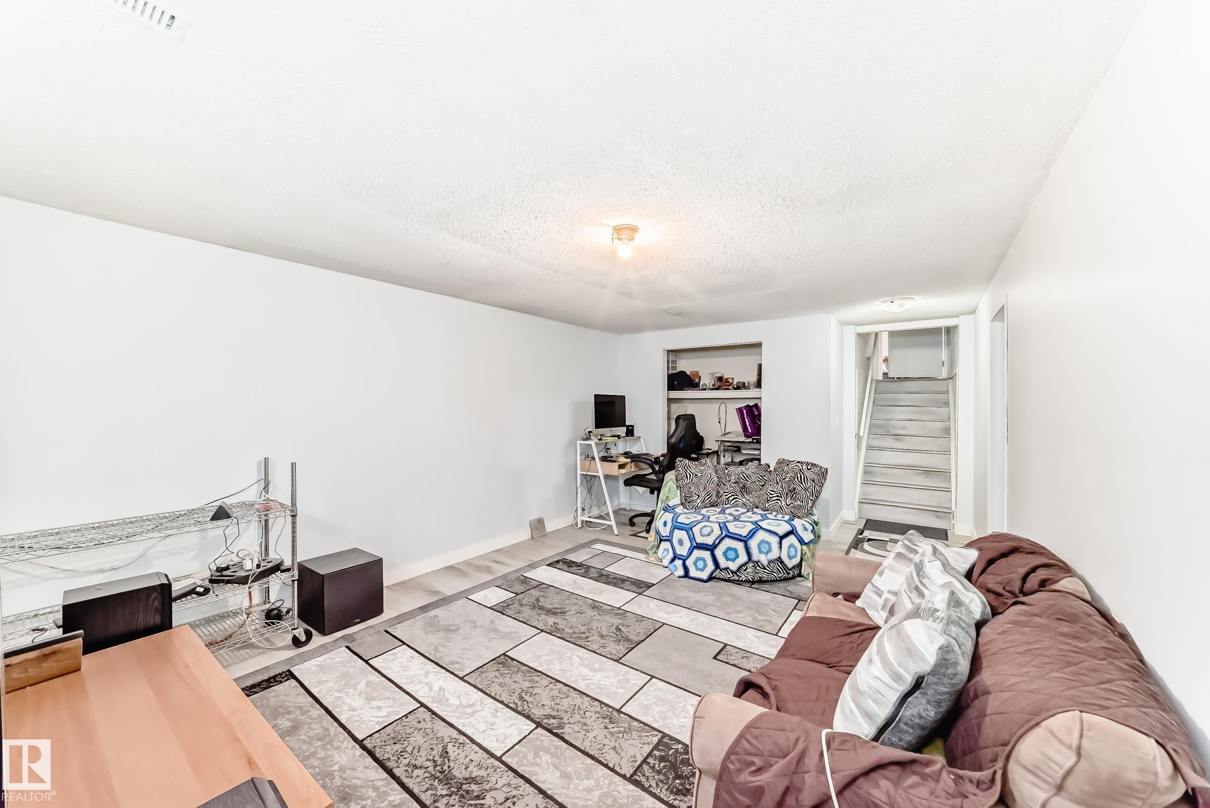 Finished interior space with light-toned wood-finish flooring - 1804 51 Street Nw, Edmonton, AB - Indoor