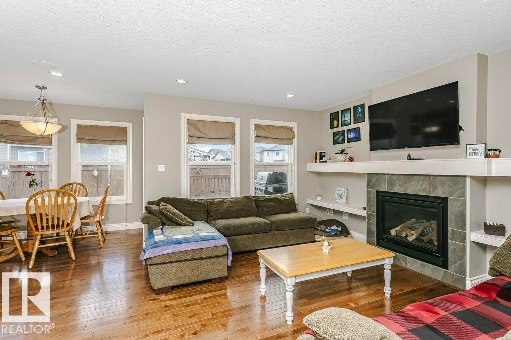 3339 21 Avenue, Edmonton, AB - Indoor Photo Showing Living Room With Fireplace