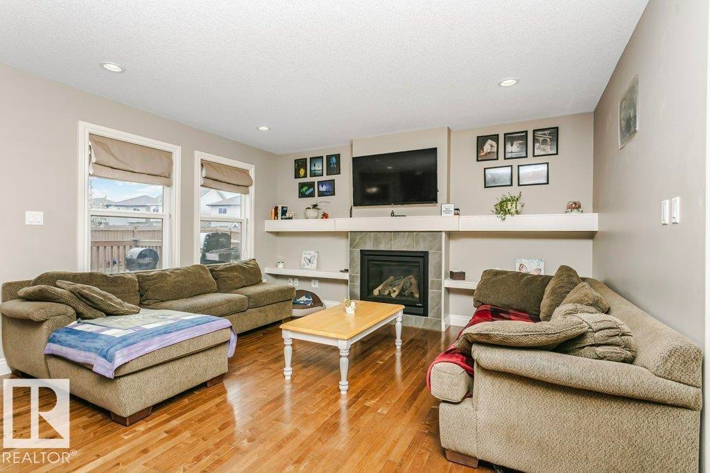 3339 21 Avenue, Edmonton, AB - Indoor Photo Showing Living Room With Fireplace
