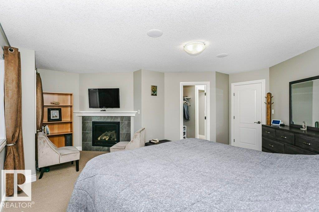 3339 21 Avenue, Edmonton, AB - Indoor Photo Showing Bedroom With Fireplace