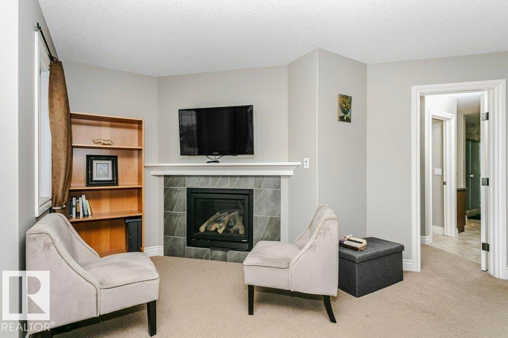 3339 21 Avenue, Edmonton, AB - Indoor Photo Showing Living Room With Fireplace