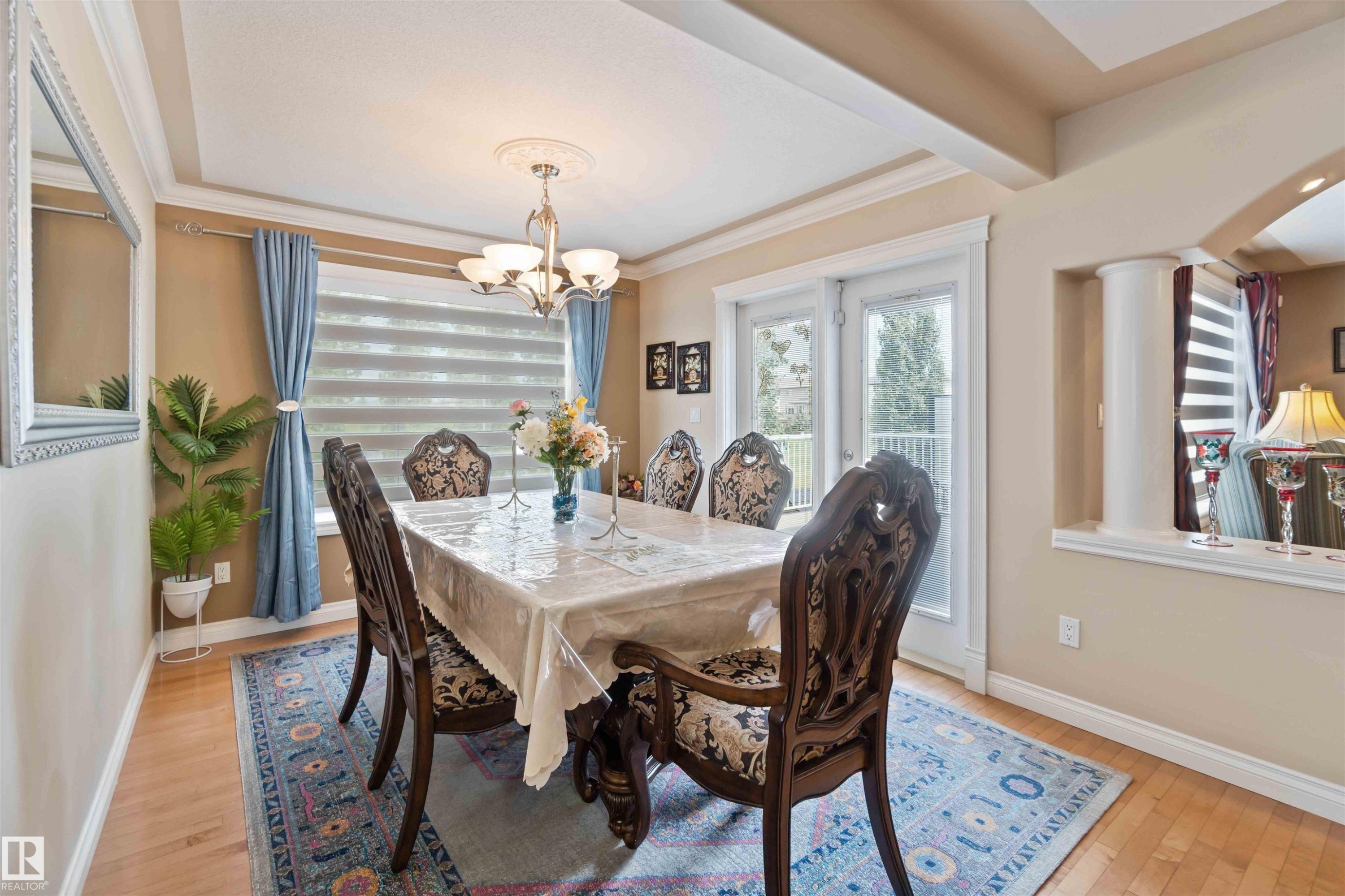 Dining area featuring hardwood flooring and a tray ceiling - 6116 53 Avenue, Beaumont, AB - Indoor Photo Showing Dining Room