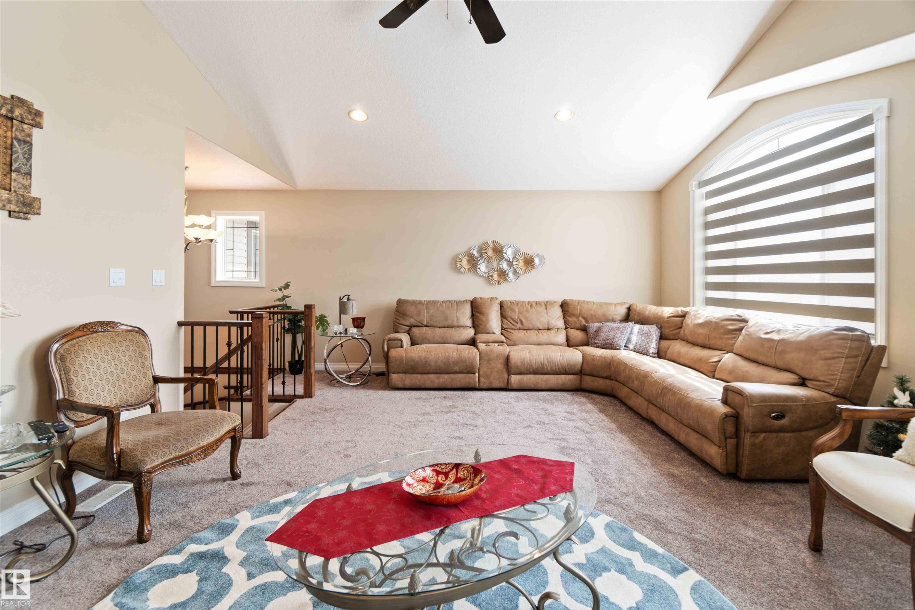 Bright living area featuring vaulted ceilings, recessed lighting, and a ceiling fan - 6116 53 Avenue, Beaumont, AB - Indoor Photo Showing Living Room