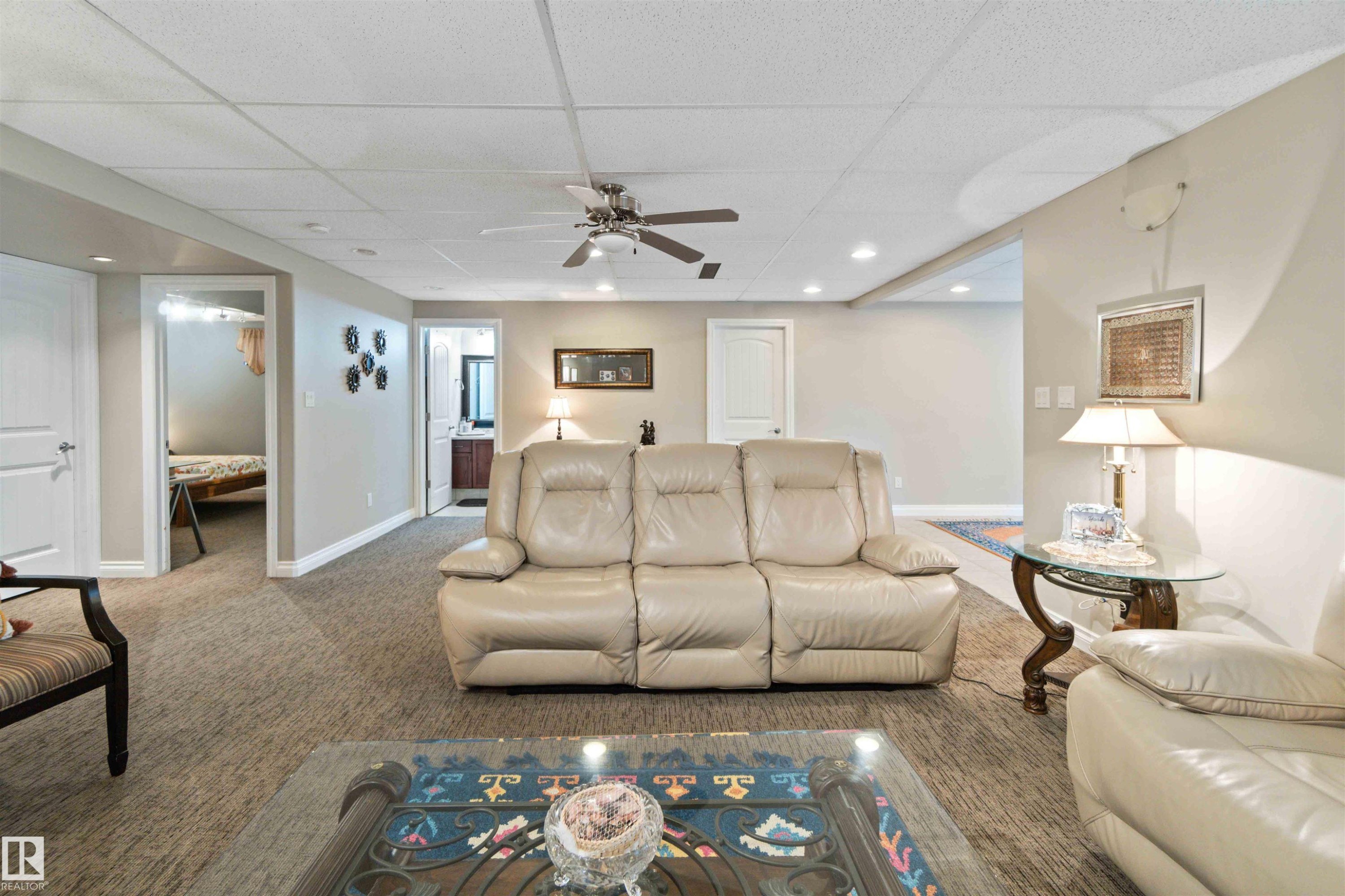 Spacious interior featuring neutral-toned walls, recessed lighting, and a ceiling fan - 6116 53 Avenue, Beaumont, AB - Indoor Photo Showing Living Room