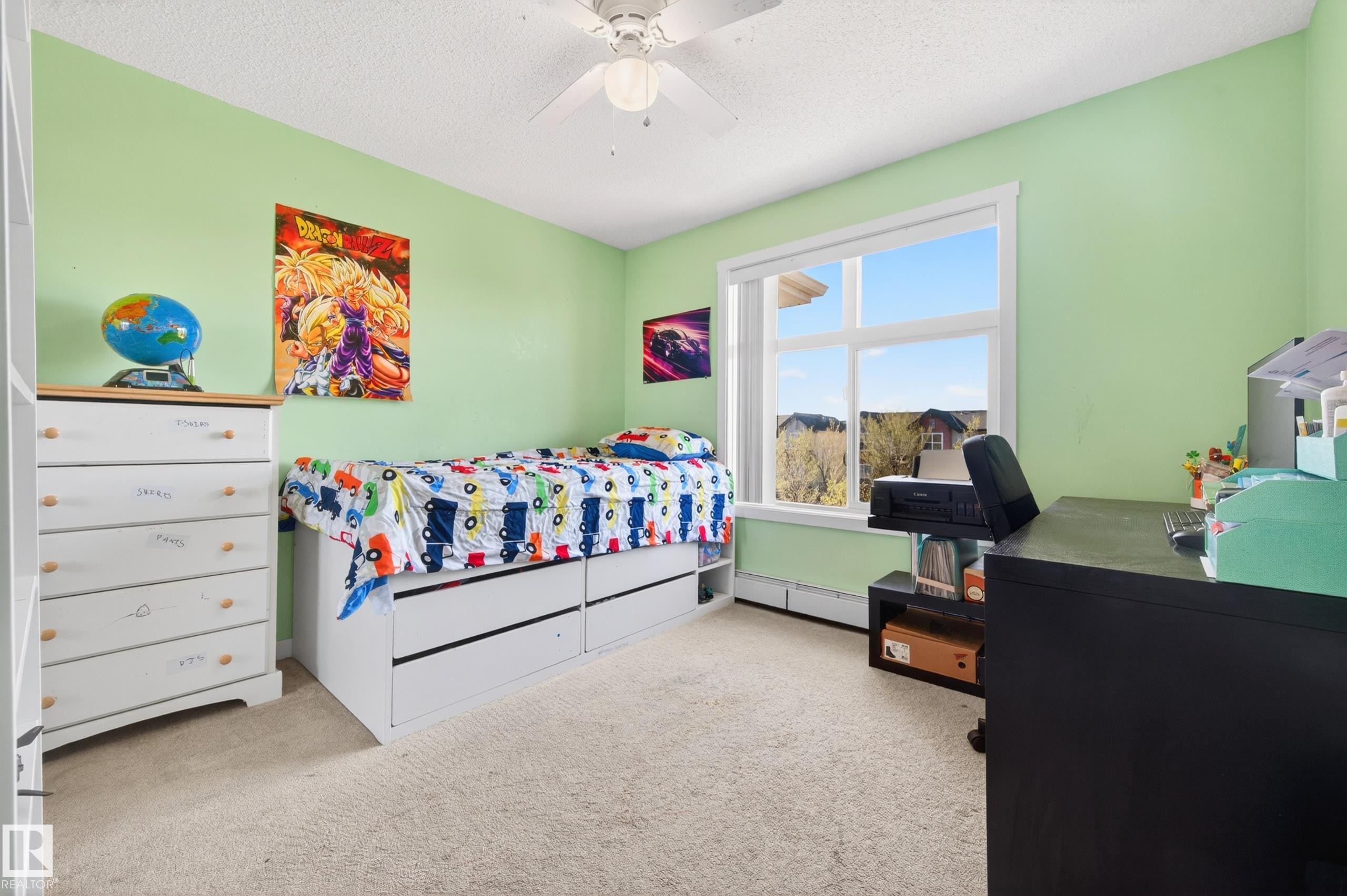 Carpeted room with light green walls and a white ceiling - 340 6076 Schonsee Way, Edmonton, AB - Indoor Photo Showing Bedroom