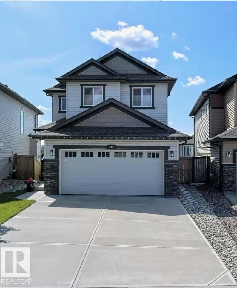 Contemporary two-story residence featuring a light gray siding exterior with dark gray trim accents - 648 178 Street, Edmonton, AB