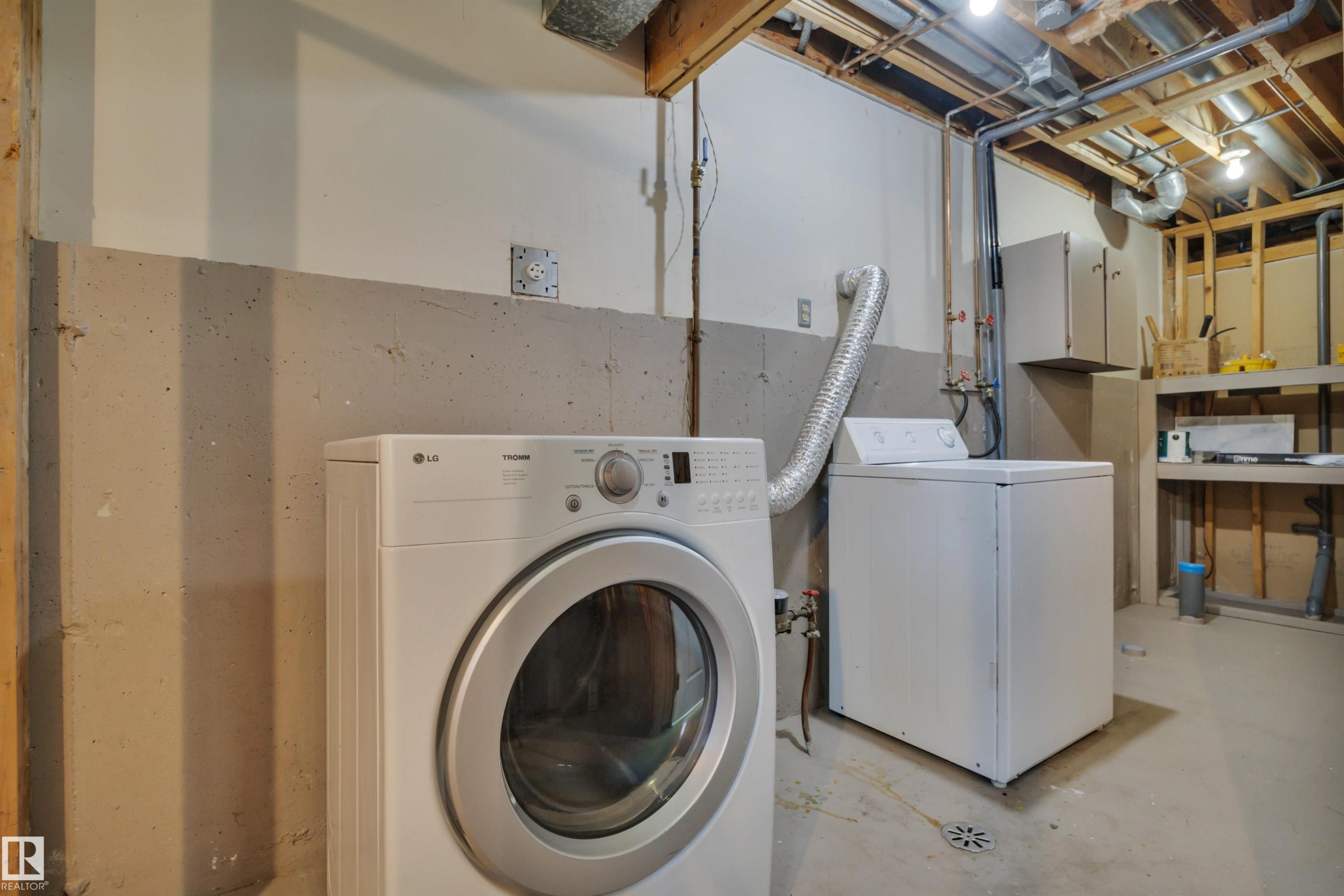 52 Pipestone Drive, Devon, AB - Indoor Photo Showing Laundry Room